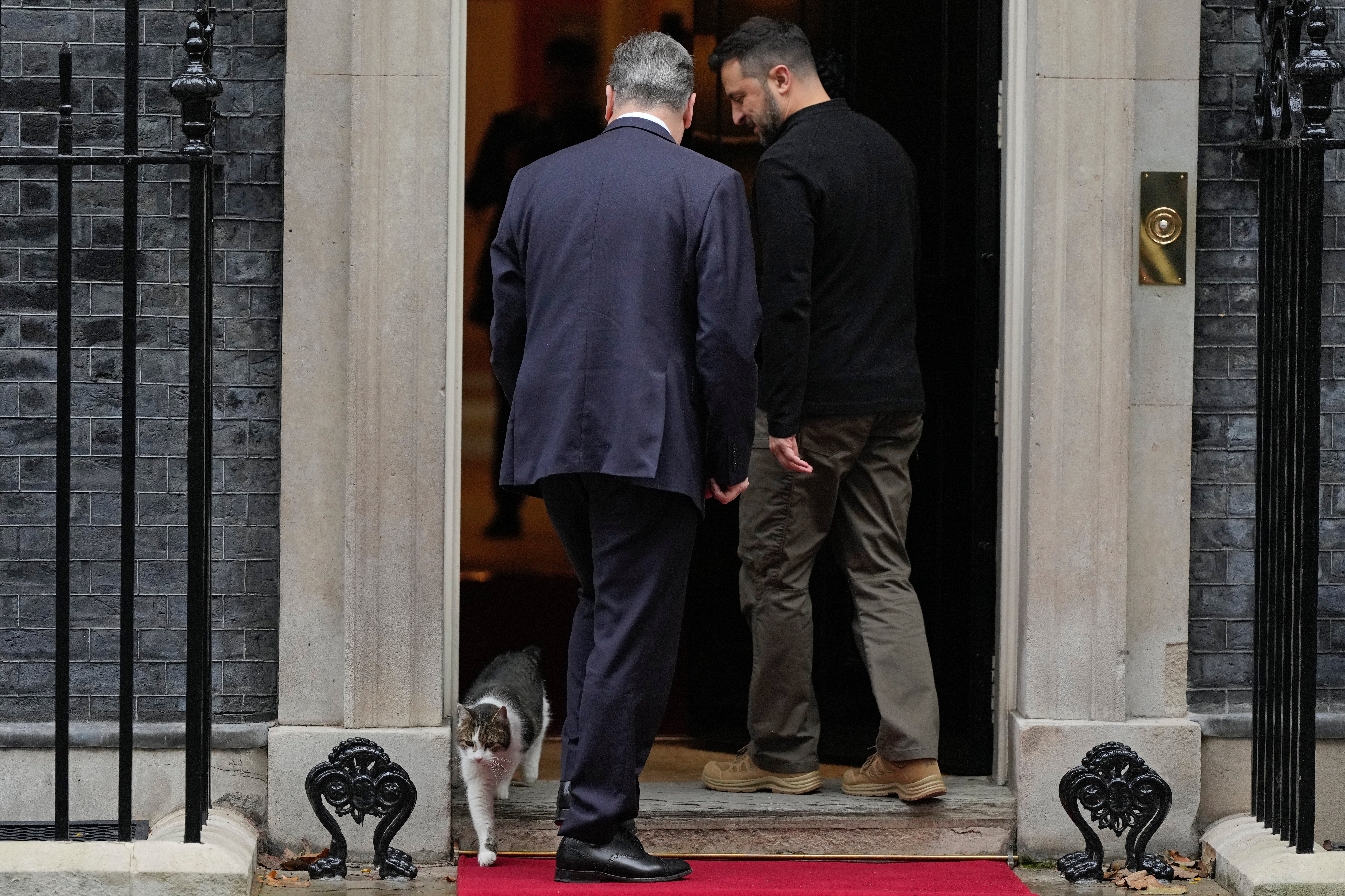 Britain's Prime Minister Keir Starmer welcomes Ukrainian President Volodymyr Zelenskyy to 10 Downing Street as Larry the Cat steps out