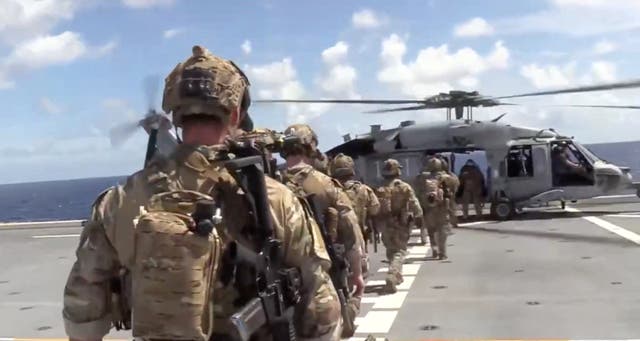 <p>U.S. forces prepare to board the vessel Veronica III</p>