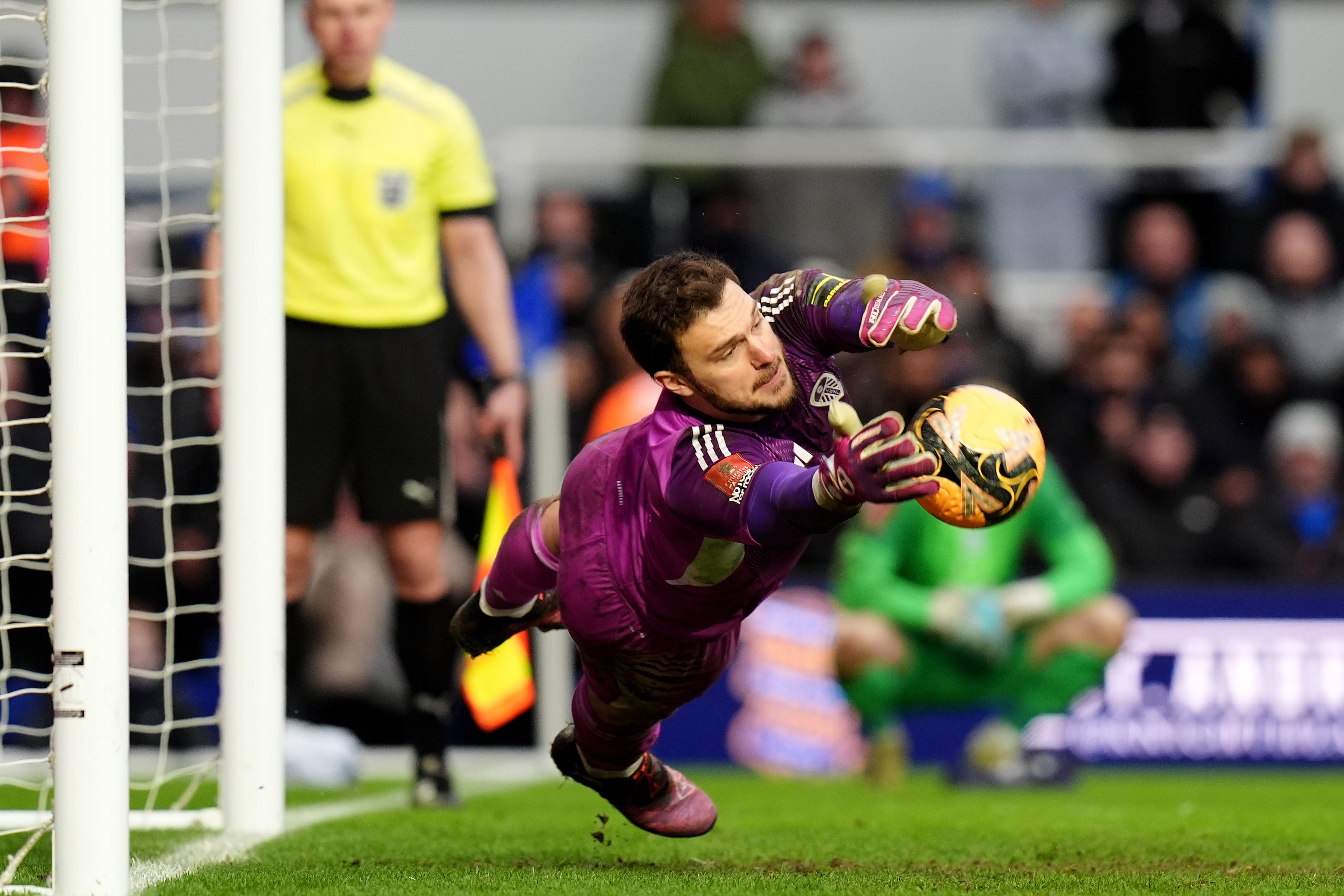 Leeds goalkeeper Lucas Perri saves Tommy Doyle’s penalty in the shootout (Jacob King/PA)