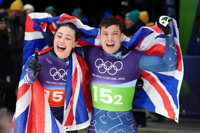 <p>Great Britain’s Matt Weston and Tabitha Stoecker celebrate winning gold after the skeleton mixed team final</p>