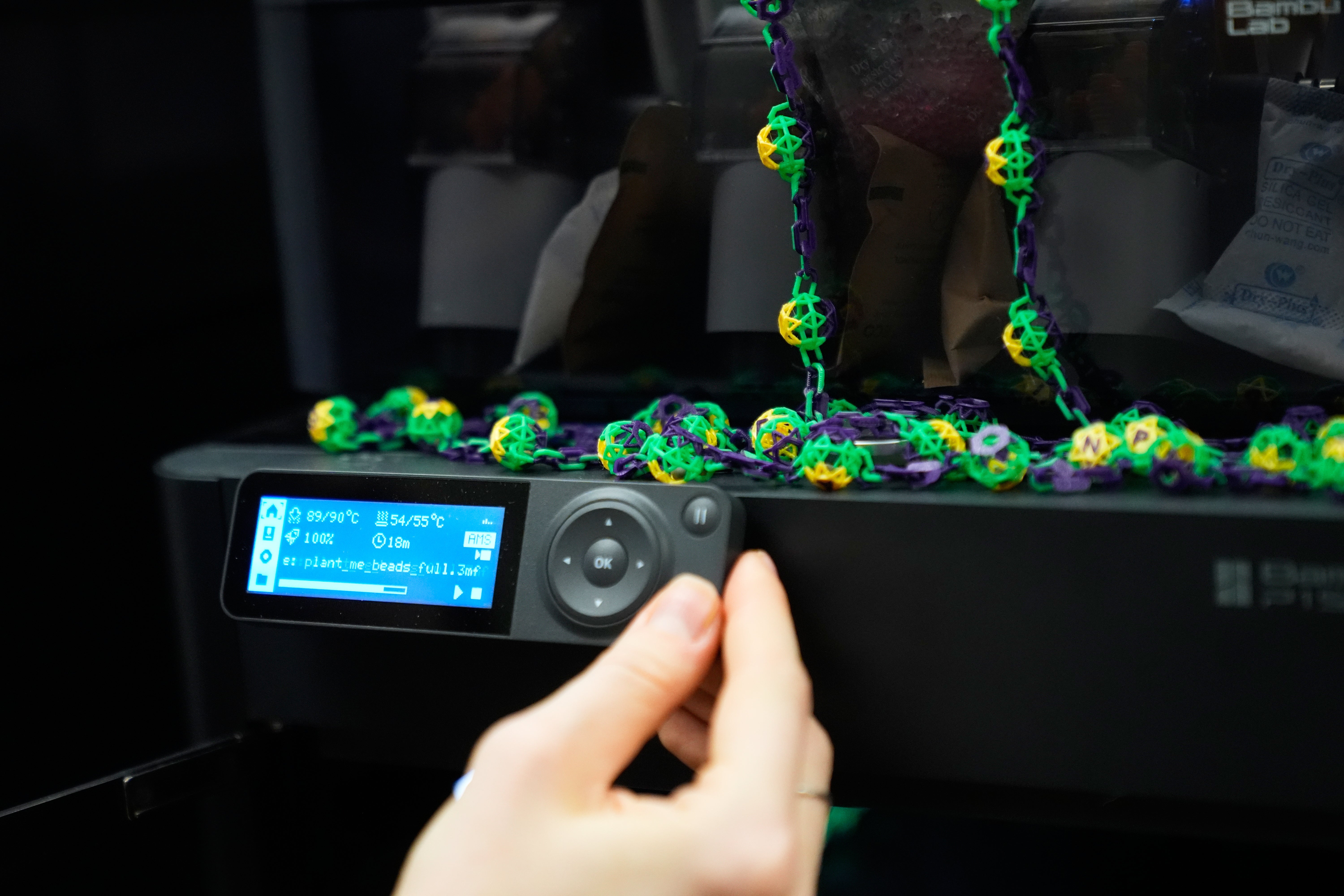 Alexis Strain, graduate student in biological sciences at Louisiana State University shows A 3D printer they are using to create biodegradable Mardi Gras beads, Jan. 27, 2026, in Baton Rouge, La. (AP Photo/Gerald Herbert)