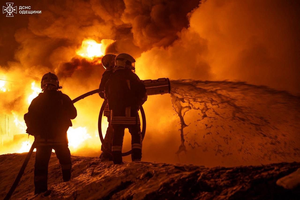 Firefighters extinguishing a fire after a Russian drone strike in Odessa on Sunday