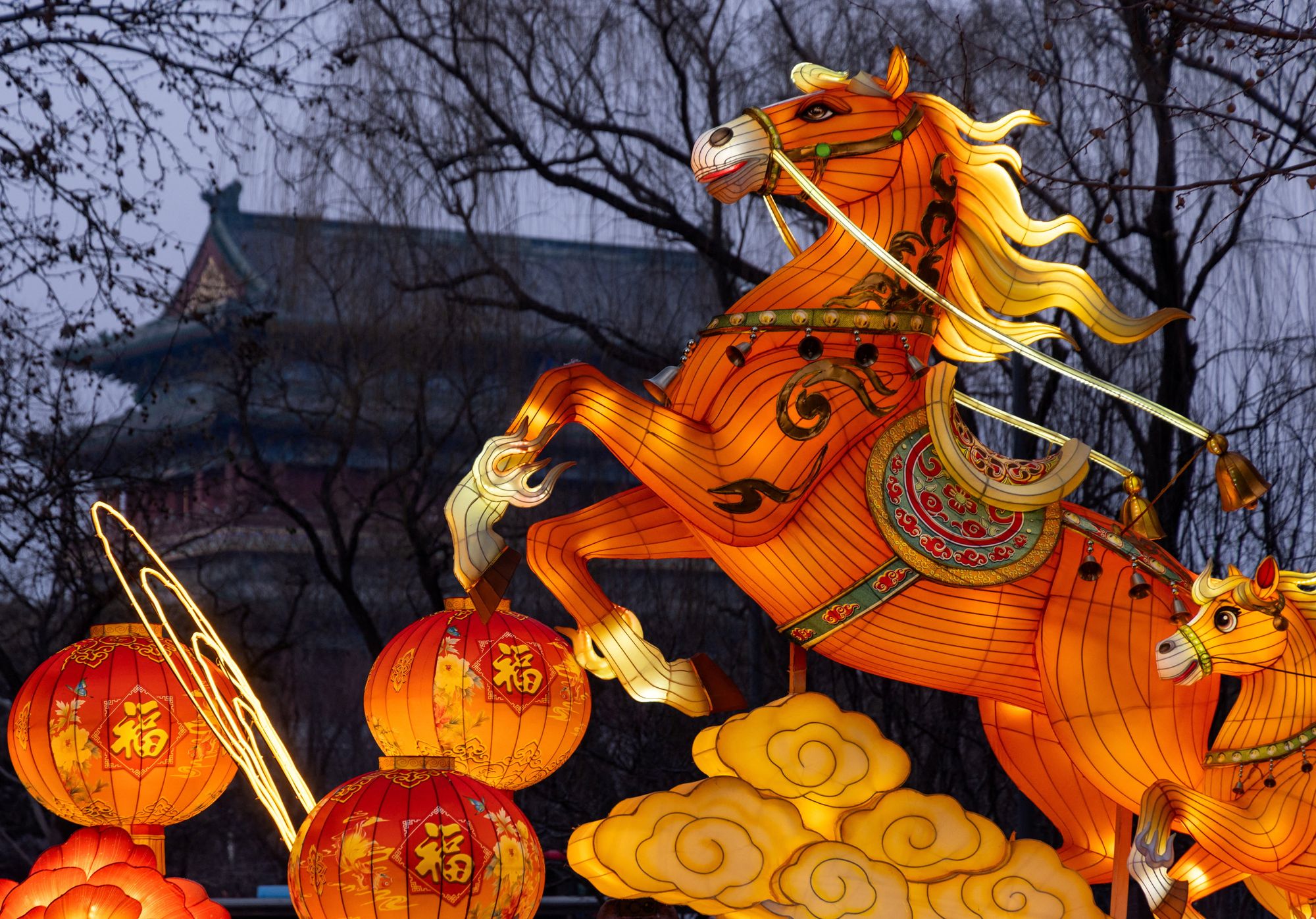 <p>A light installation depicting a Fire Horse appears next to Zhengyang Gate Tower ahead of the Lunar New Year, in Beijing, China.</p>