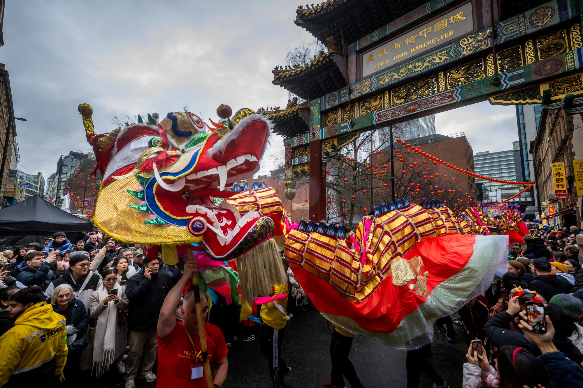 Crowds in Manchester view the Chinese and Lunar New Year celebrations as the Dragon Parade makes it’s way through Chinatown.