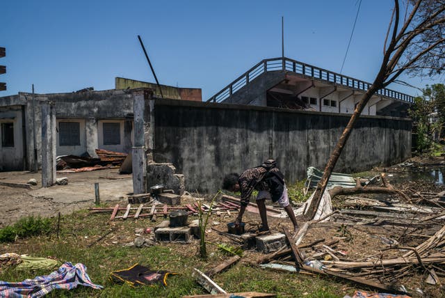 <p>A resident prepares food at a public primary school used as a shelter for people affected by the passage of tropical cyclone Gezani during the night of February 10 to 11, in Toamasina on February 15, 2026</p>
