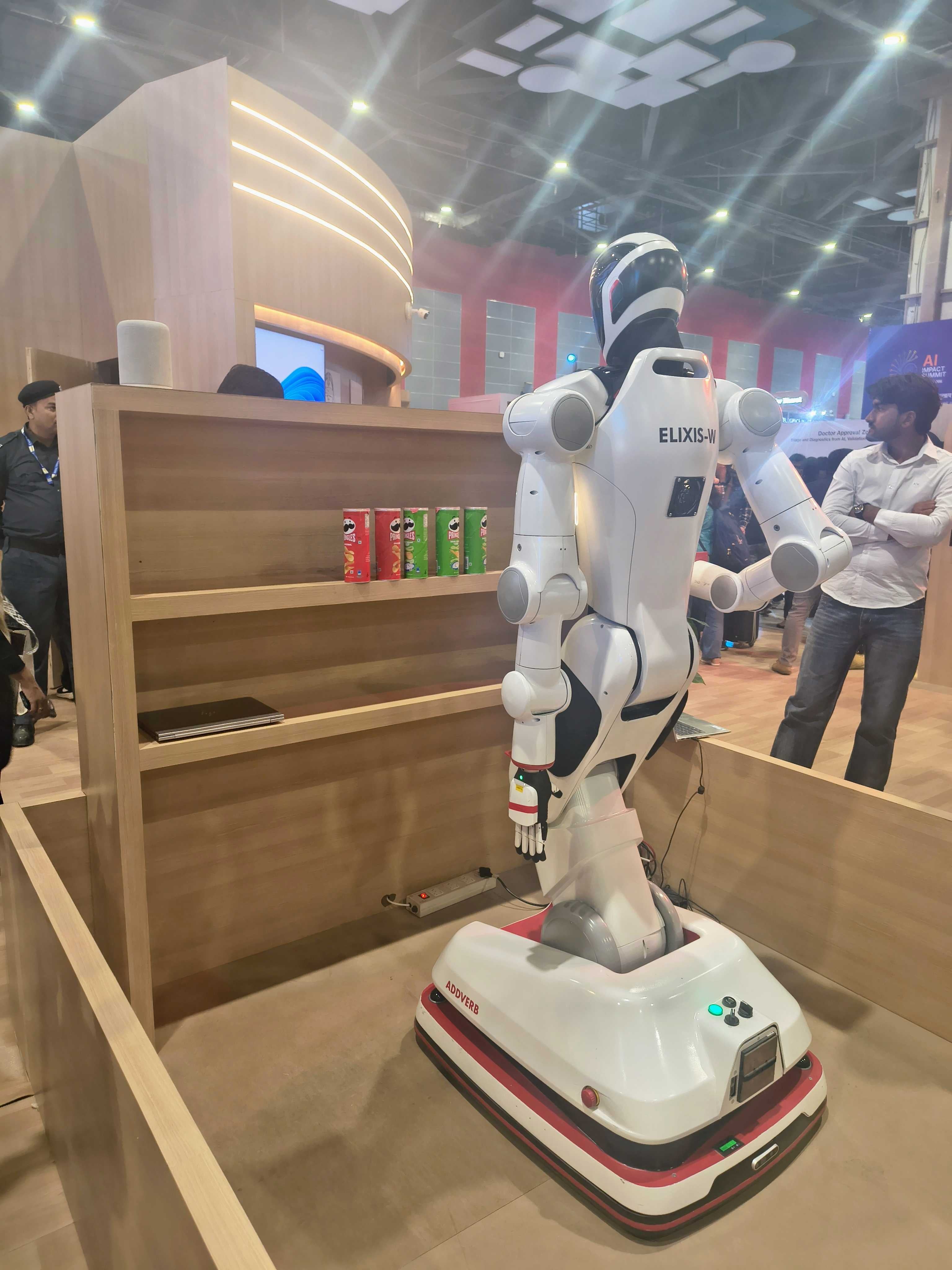 A robot picks up a snack to serve as part of an exhibition