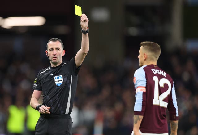 <p>Lucas Digne of Aston Villa is shown a yellow card by referee Chris Kavanagh during the Emirates FA Cup Fourth Round match between Aston Villa and Newcastle United </p>