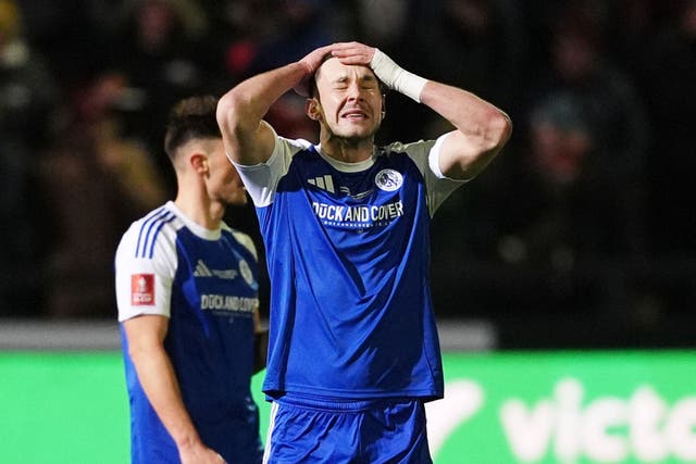 Sam Heathcote reacts after he scored an own goal (Martin Rickett/PA)
