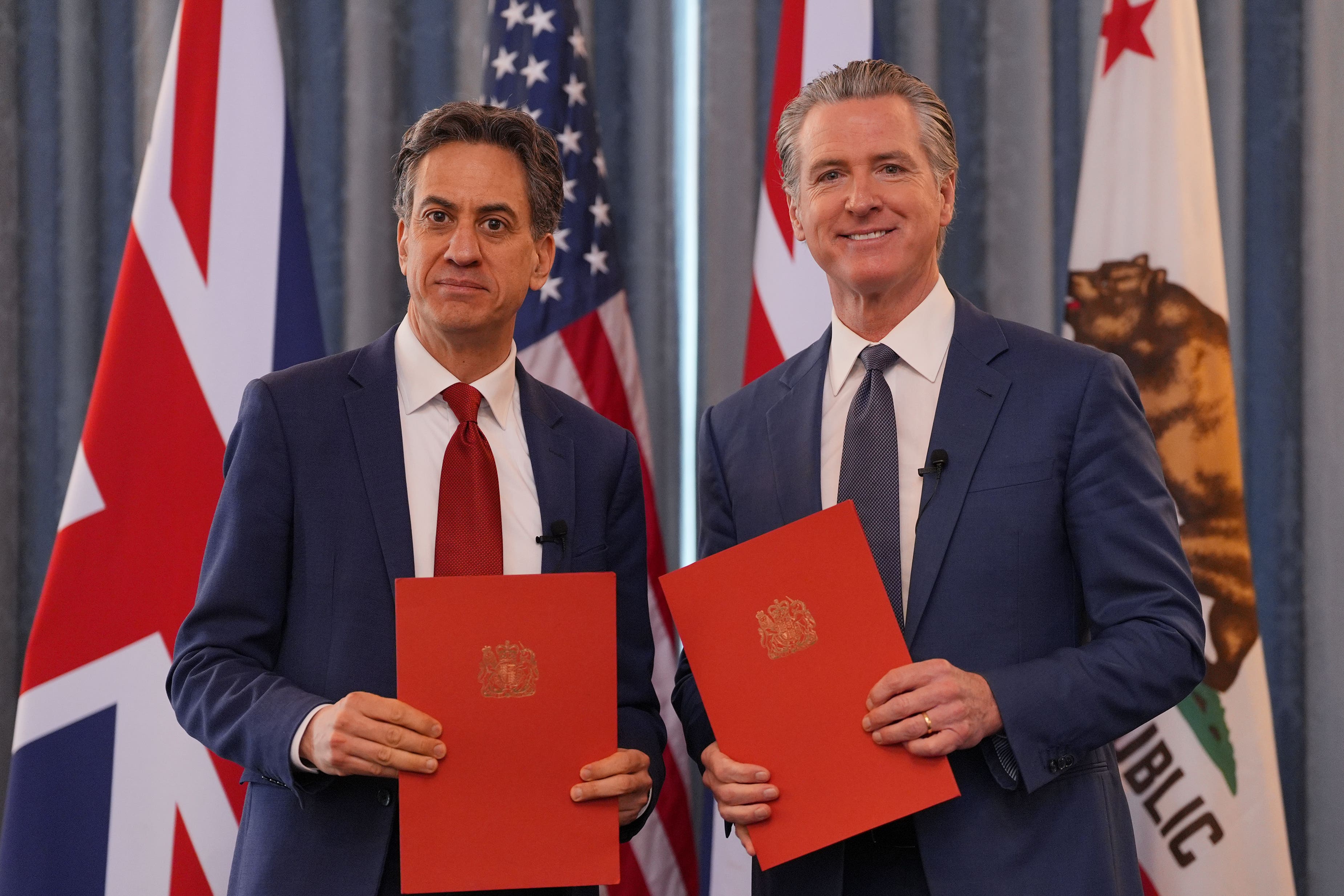 Ed Miliband and Gavin Newsom signed a clean energy agreement at the Foreign Office in London (Yui Mok/PA)