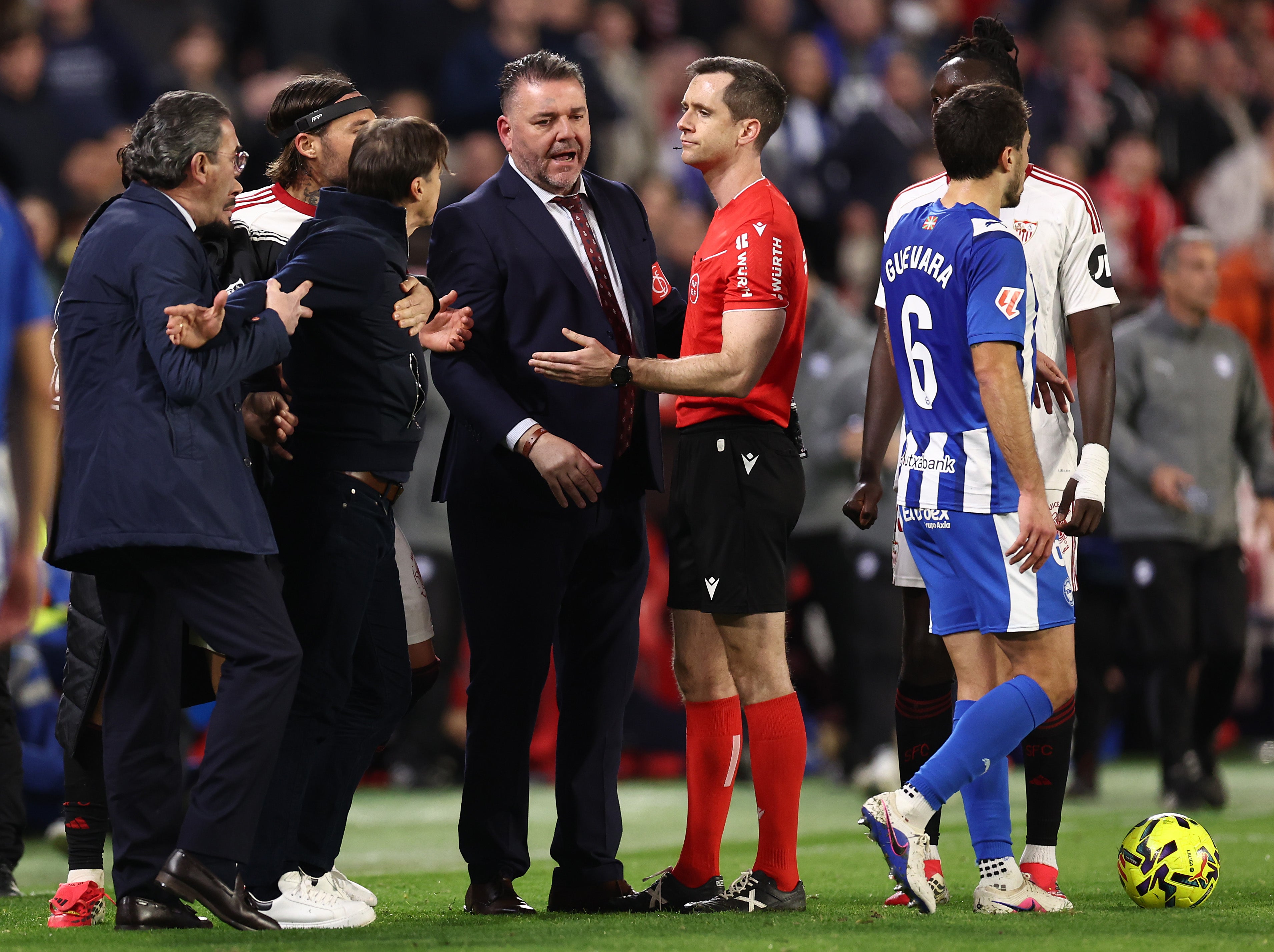 Sevilla boss Matias Almeyda (left) had to be held back after being shown red