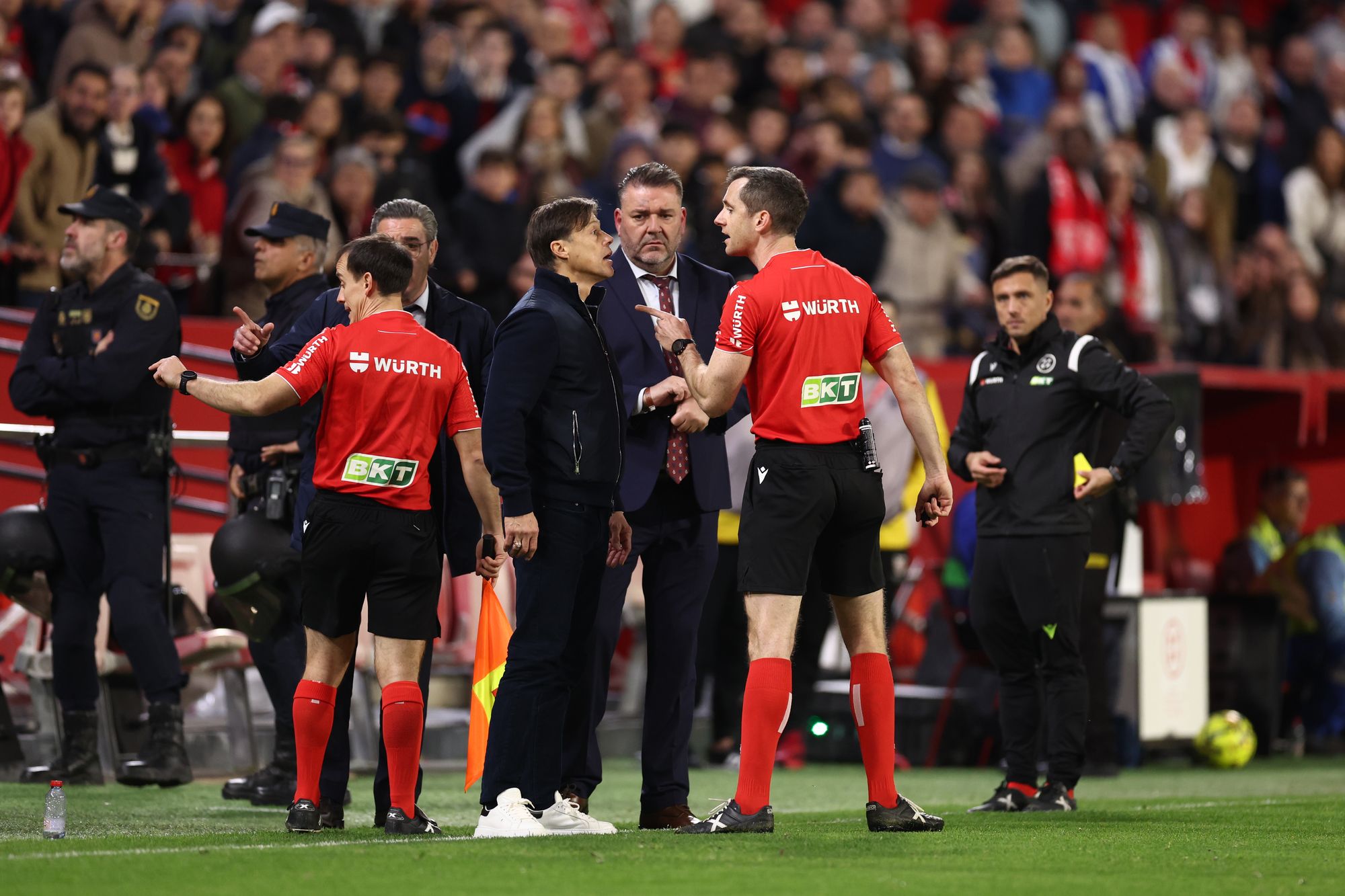 Sevilla boss Matias Almeyda (left) confronting the referee after being sent off