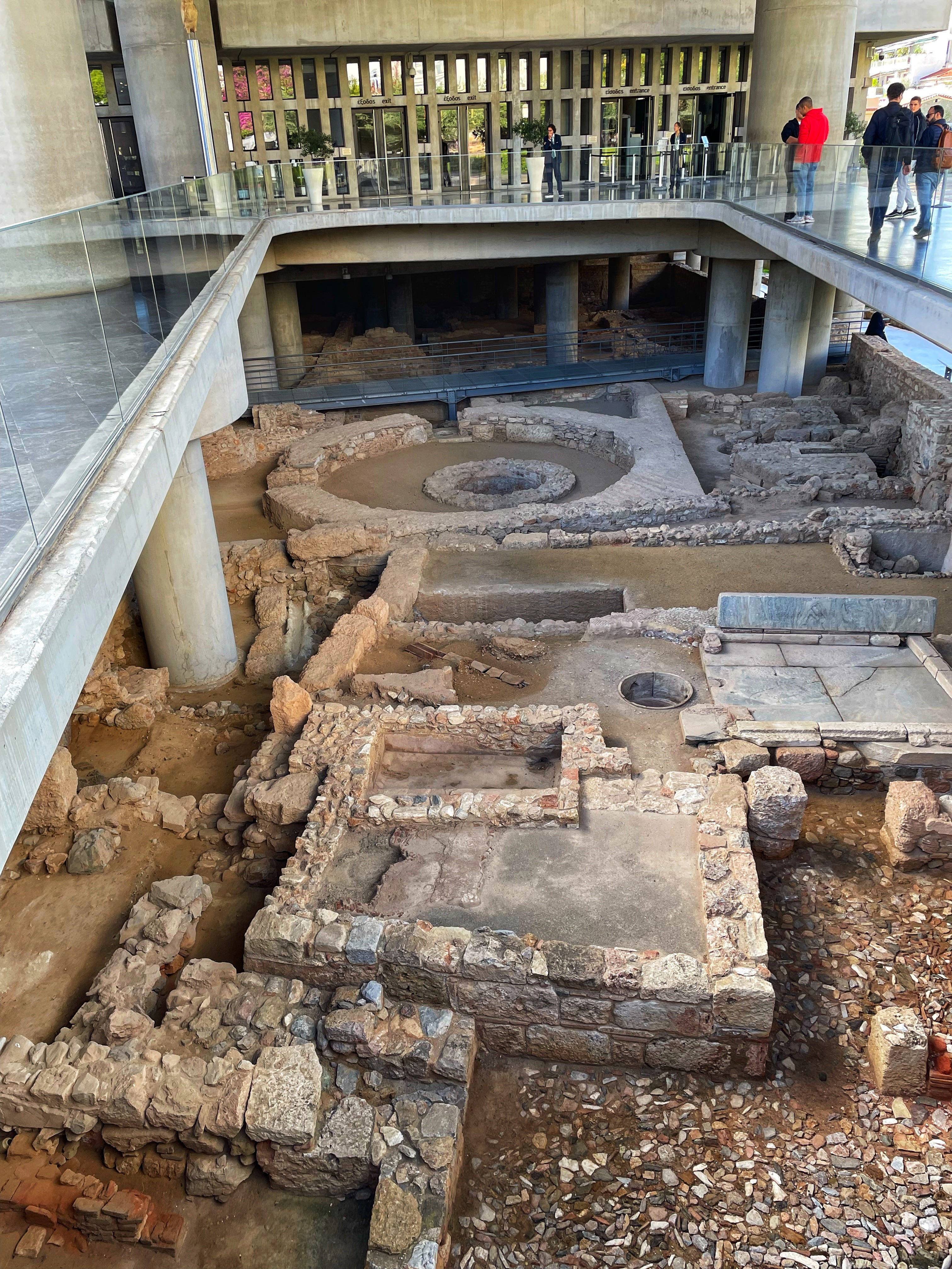Visitors can walk over extensive glass walkways revealing the remains of an ancient Athenian neighbourhood before even entering the Acropolis Museum