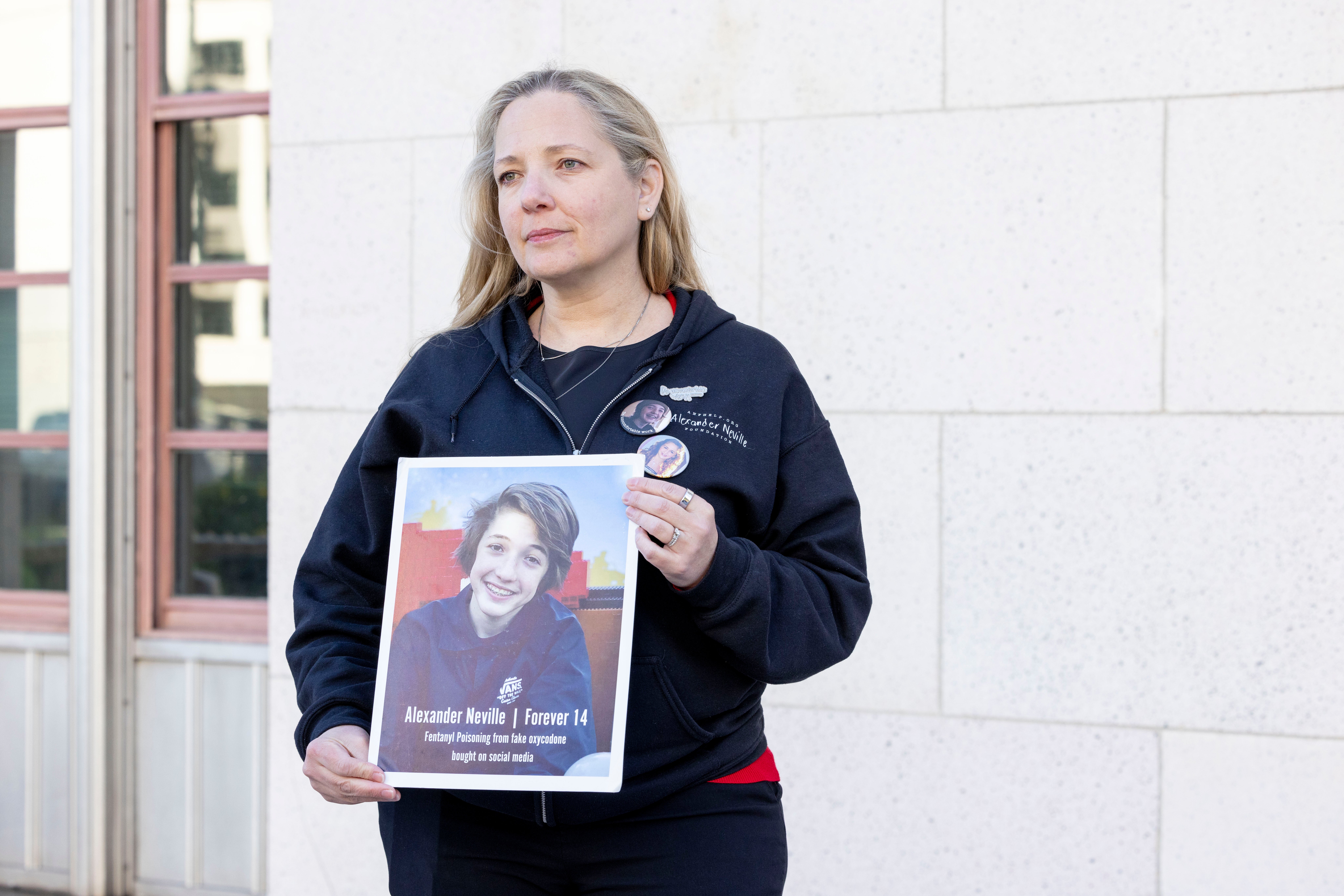 Outside the courthouse, a woman named Amy Neville displayed a picture of her son Alexander, who died at 14 from fentanyl bought through social media