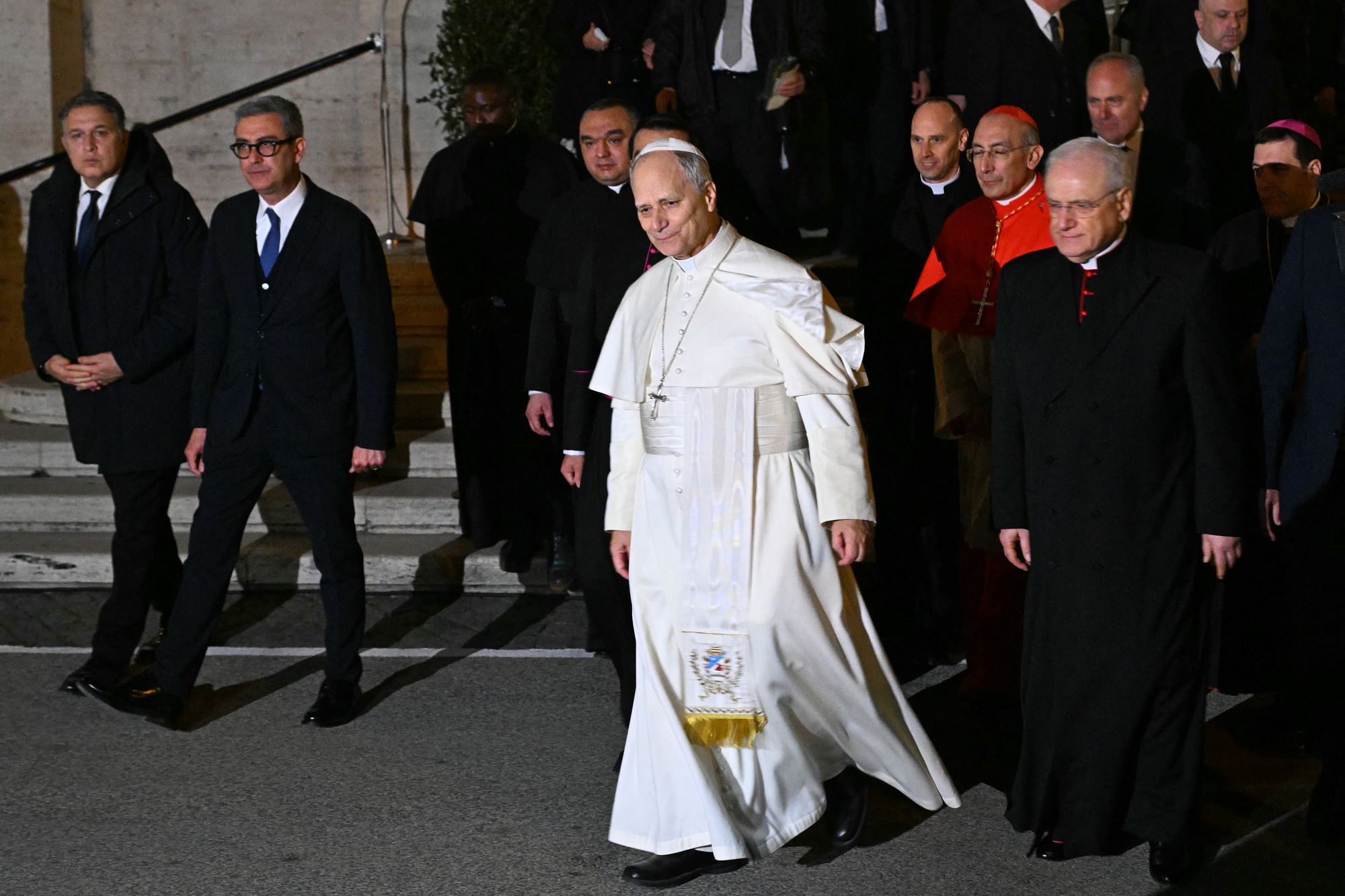 Pope Leo XIV leaves at the end of a mass during a pastoral visit to the parish of ‘St Mary Queen of Peace’ at Ostia Lido, near Rome, on 15 February 2026. Pope Leo, the first American pontiff and a known critic of some of Donald Trump’s policies, was invited to join the ‘Board of Peace’ in January