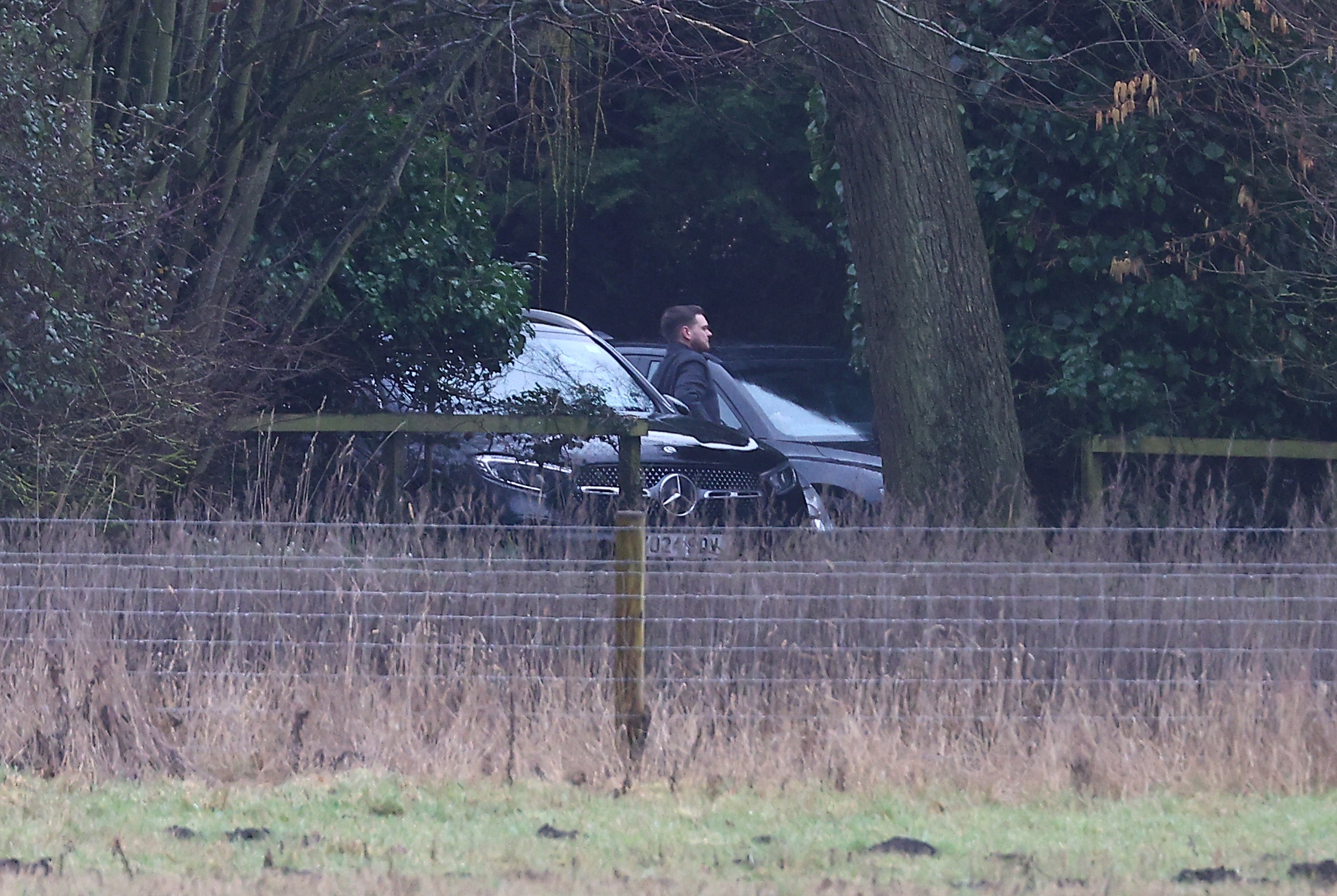 A man steps out of an unmarked car at the home of Andrew Mountbatten-Windsor on February 19, 2026 in Sandringham, Norfolk