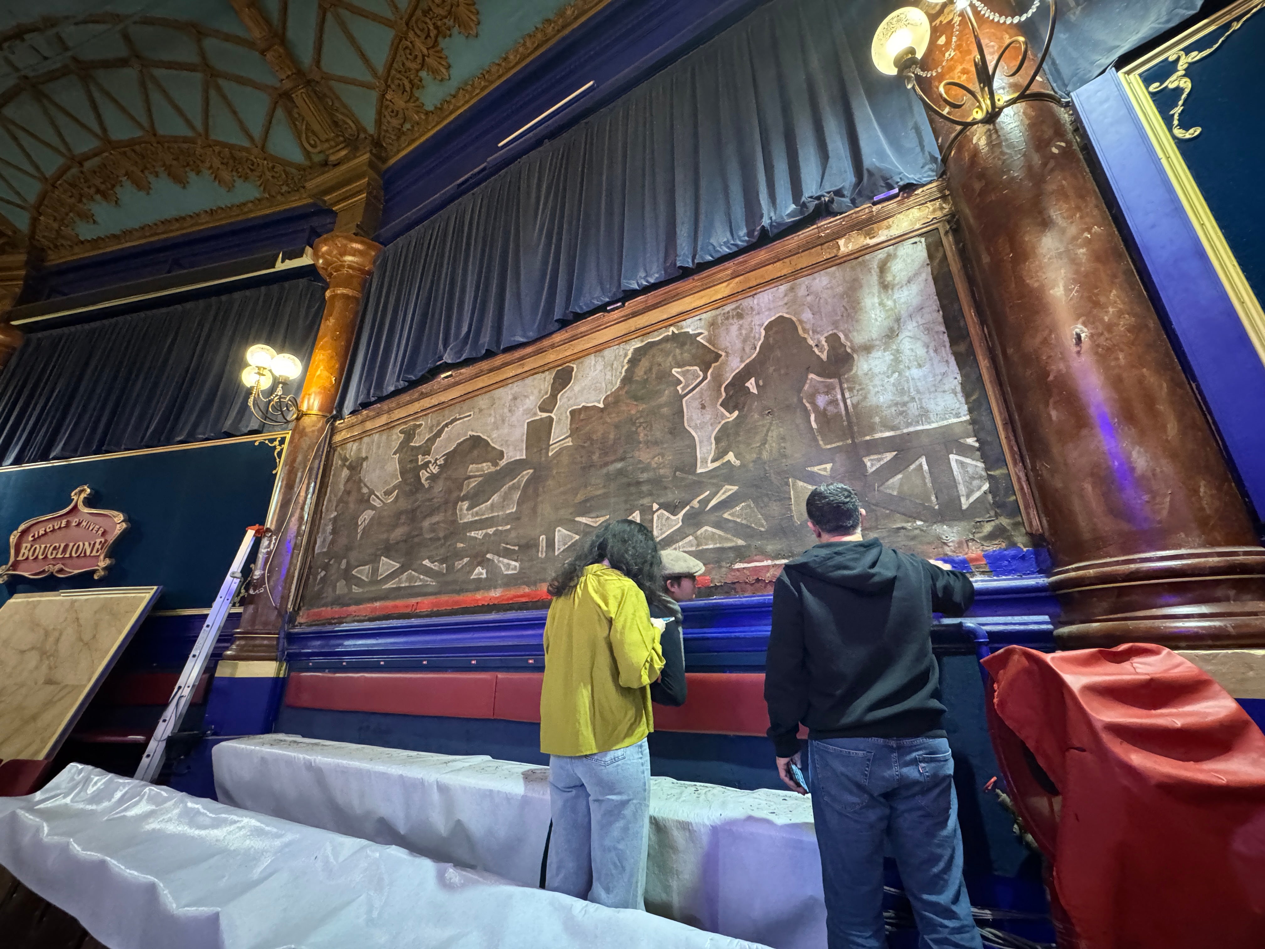 The paintings were discovered behind wood panelling