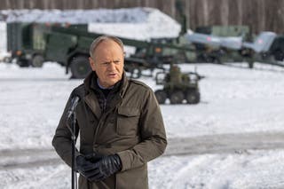 Poland's Prime Minister Donald Tusk speaks to the press after watching an open test of unmanned weapon systems conducted by Polish Armaments Group at the Military Institute of Armament Technology training ground in Zielonka, Warsaw