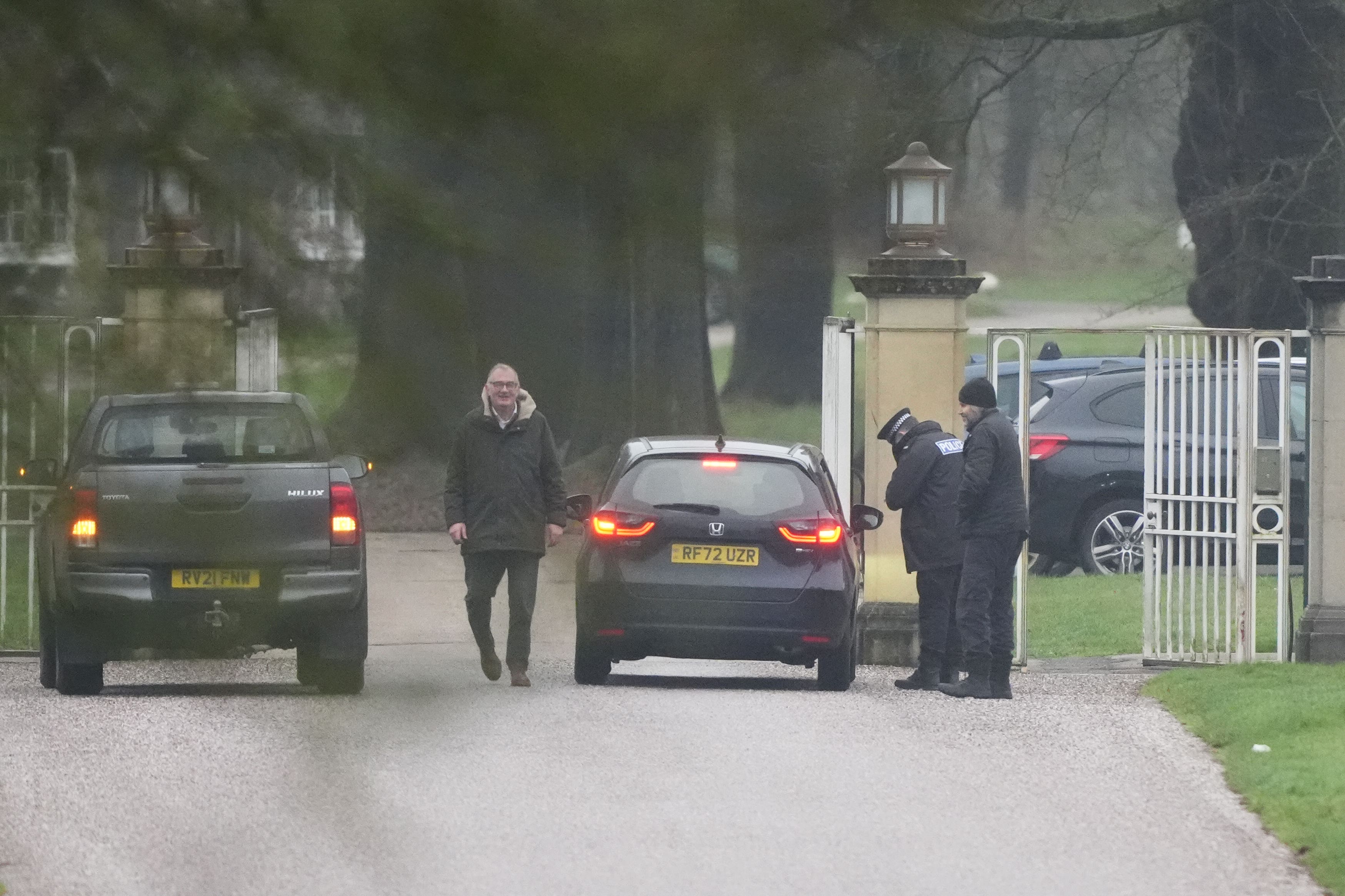 A police officer at the gates at Royal Lodge in Windsor where searches are underway