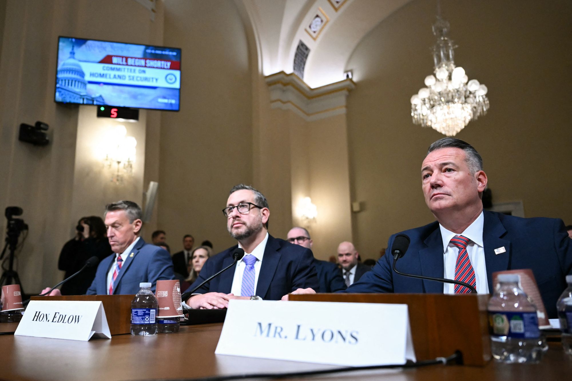 The directive signed by Joseph Edlow, center, and Todd Lyons, right, orders DHS to ‘take the affirmative actions’ of arresting and detaining recently arrived refugees who do not yet have a green card, revoking longstanding policy that said their legal status was not a ‘proper basis’ for arrest or removal from the country