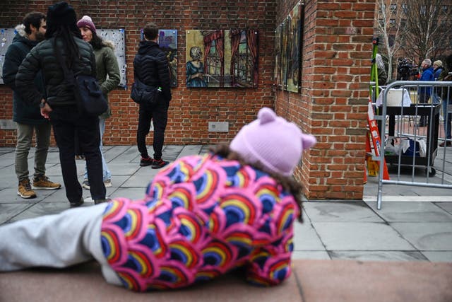 <p>People gather as panels that were part of an exhibit on slavery at the President's House Site in Philadelphia are put back Thursday, Feb. 19, 2026</p>