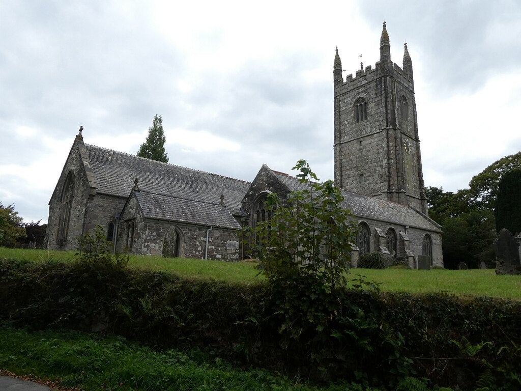 <p>Looking up the Parish Church of St Meubred in the village of Cardinham from the lane which passes through the village.</p>
