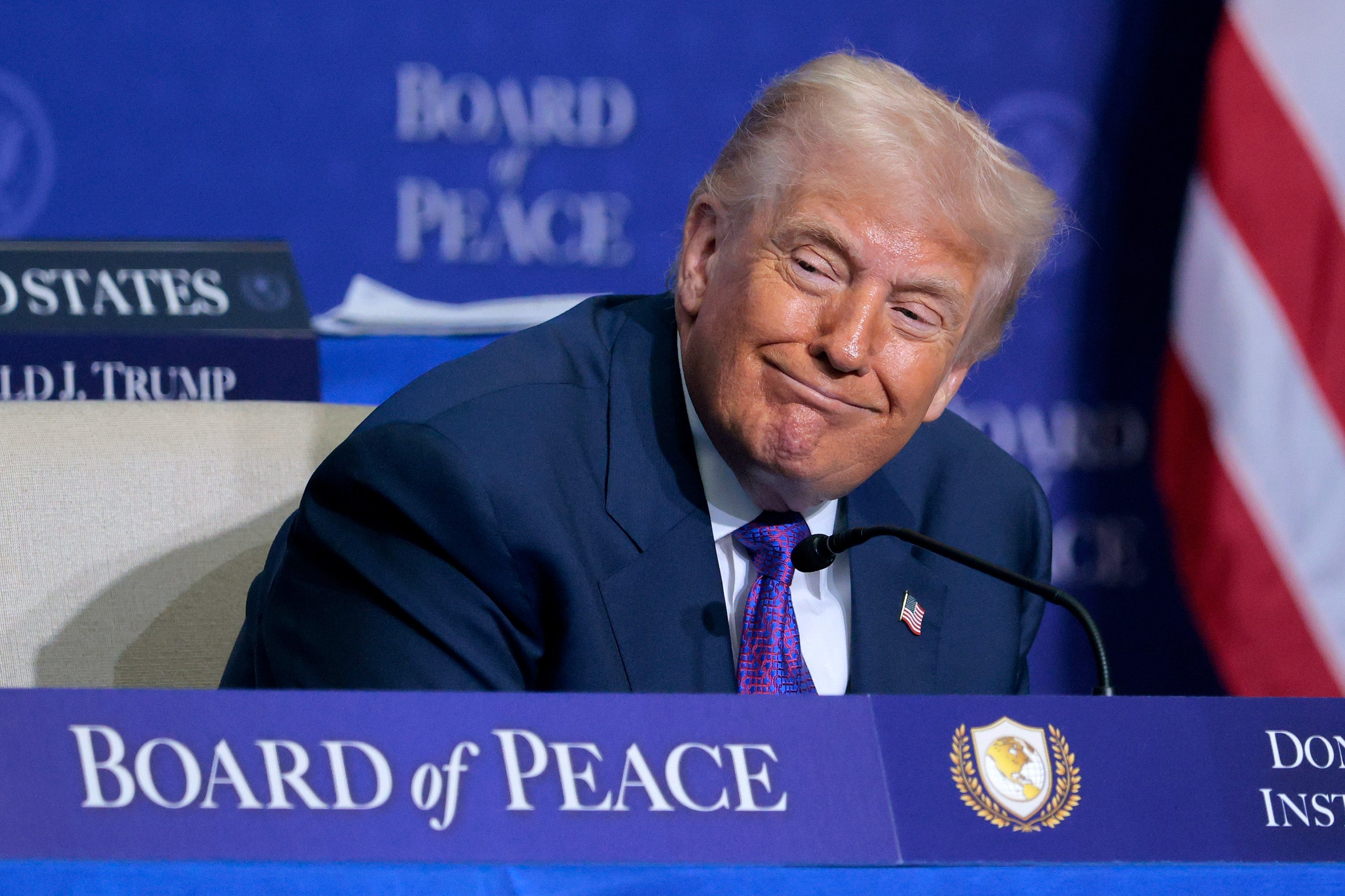 <p>US President Donald Trump looks on during speeches at the inaugural meeting of the Board of Peace at the Donald J. Trump Institute of Peace</p>