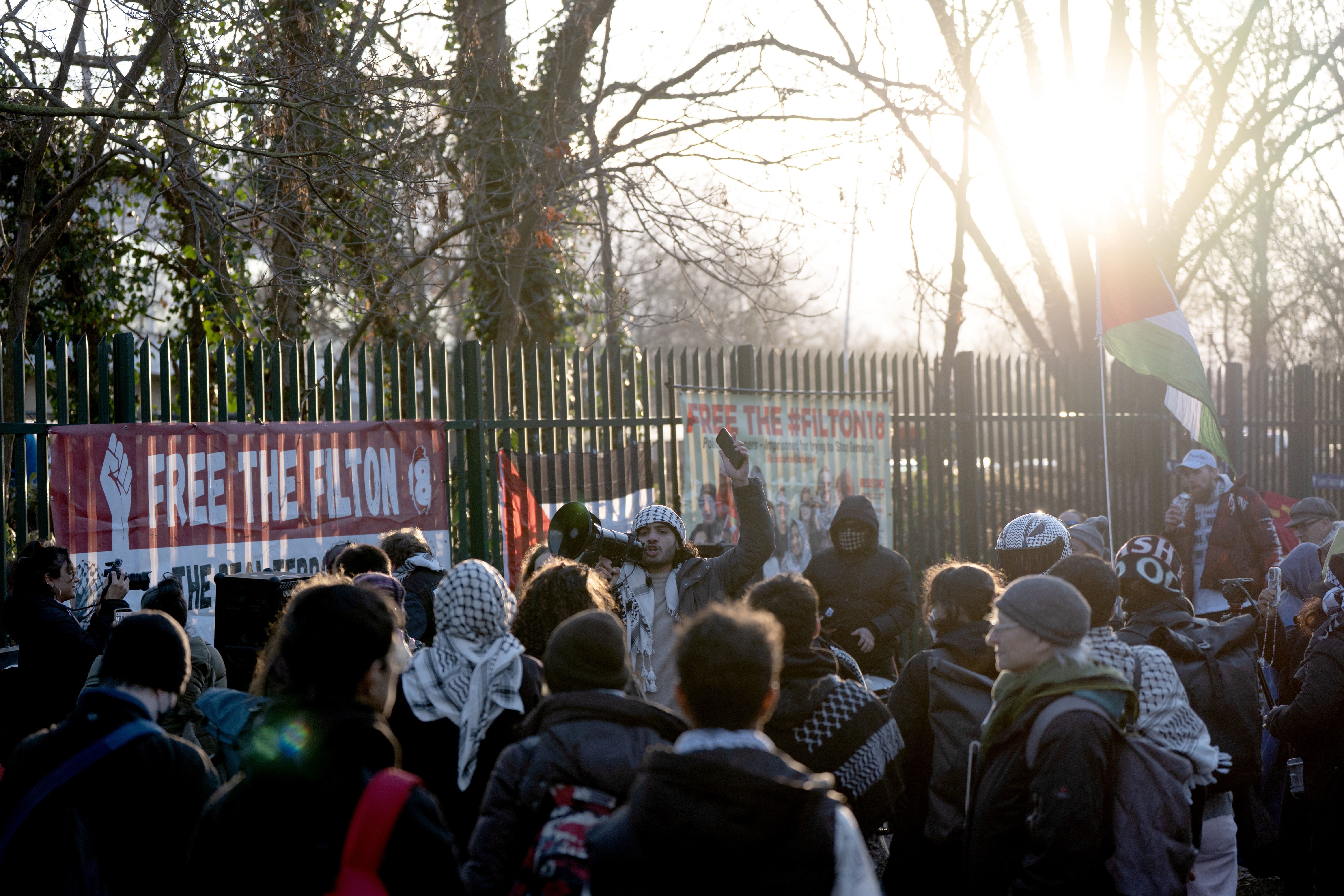 Protesters gather outside Woolwich Crown Court (PA)
