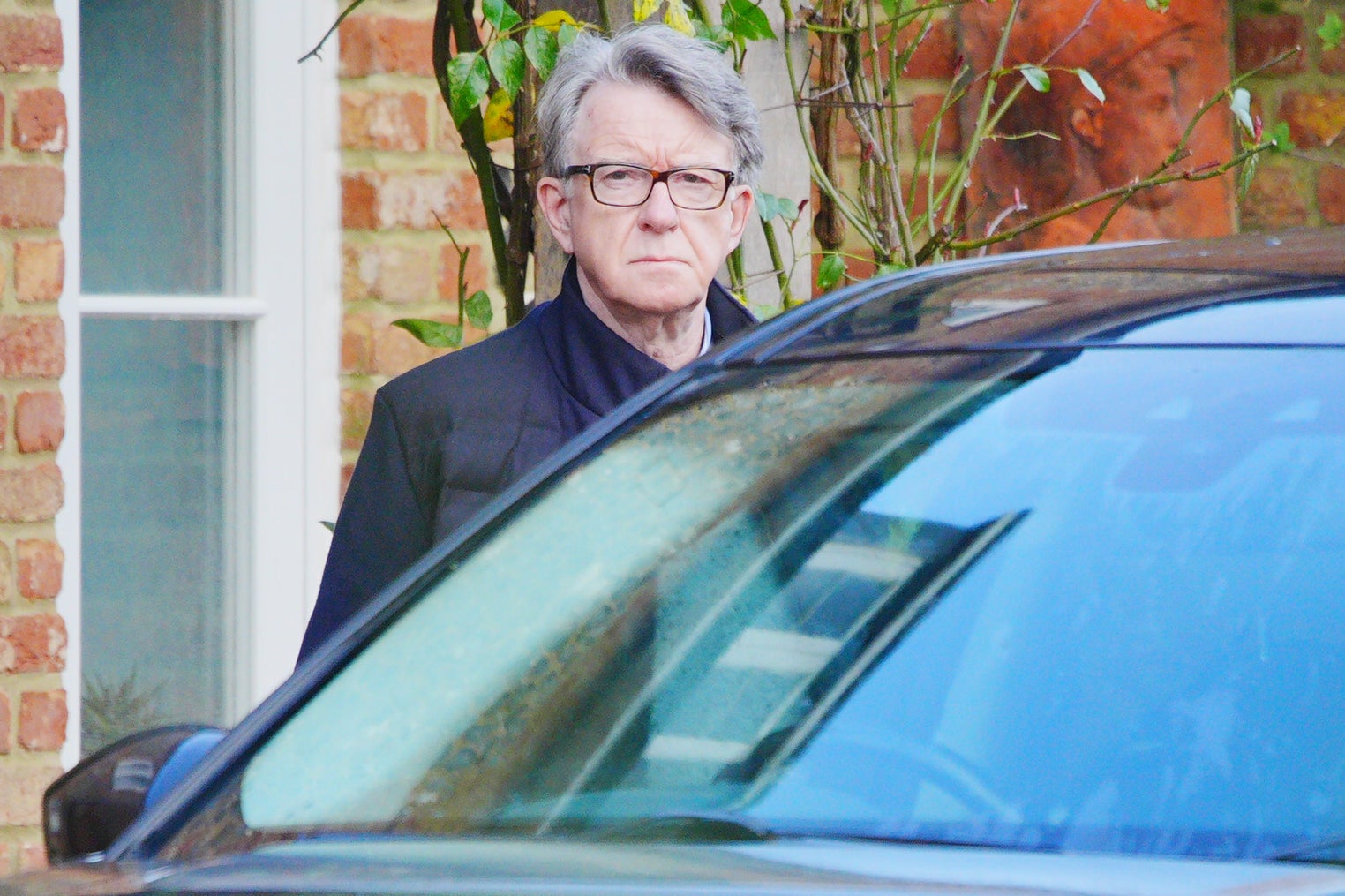 Peter Mandelson leaving his London home on Friday