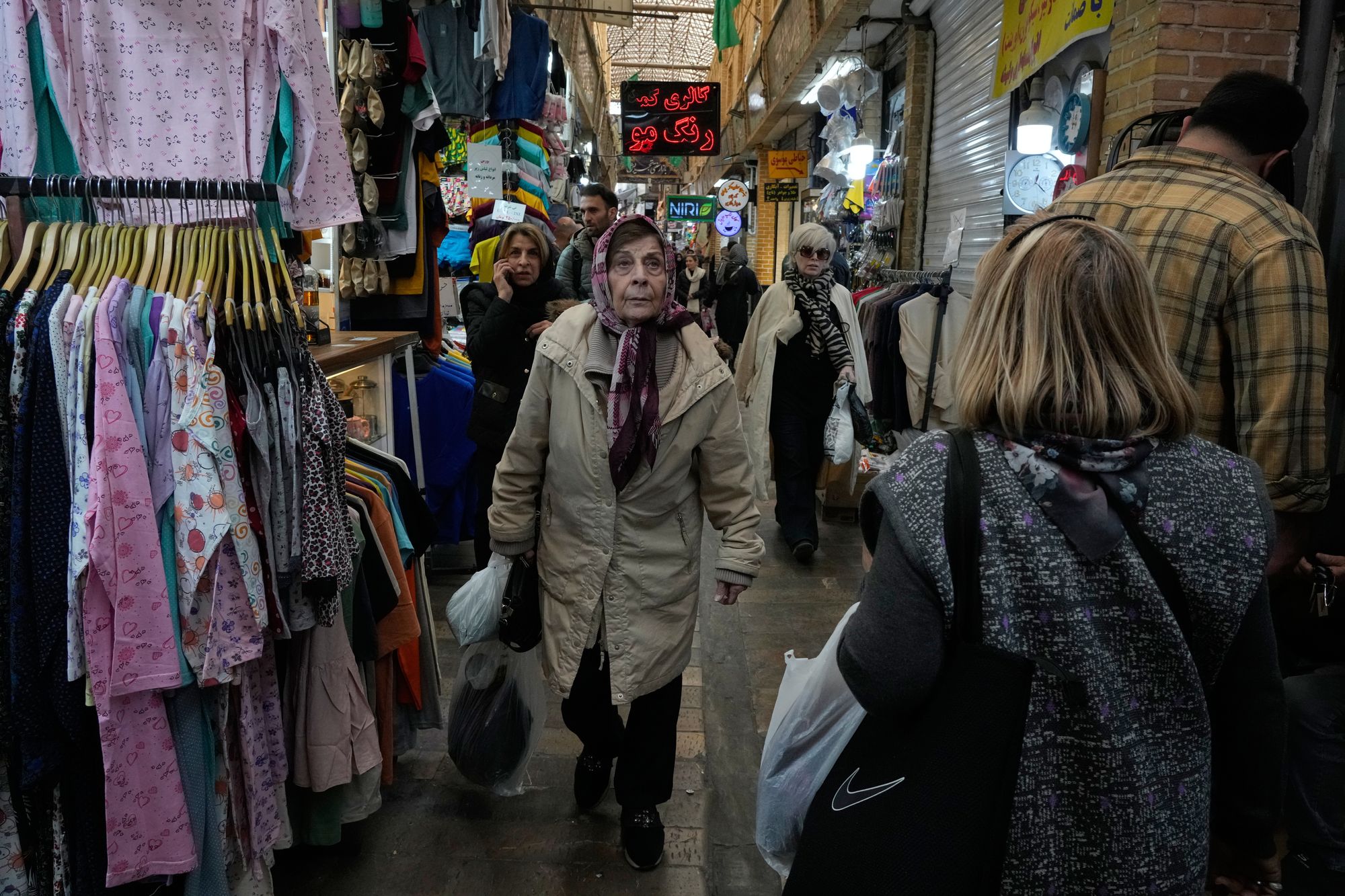 People walk at Tajrish traditional bazaar in northern Tehran, Iran