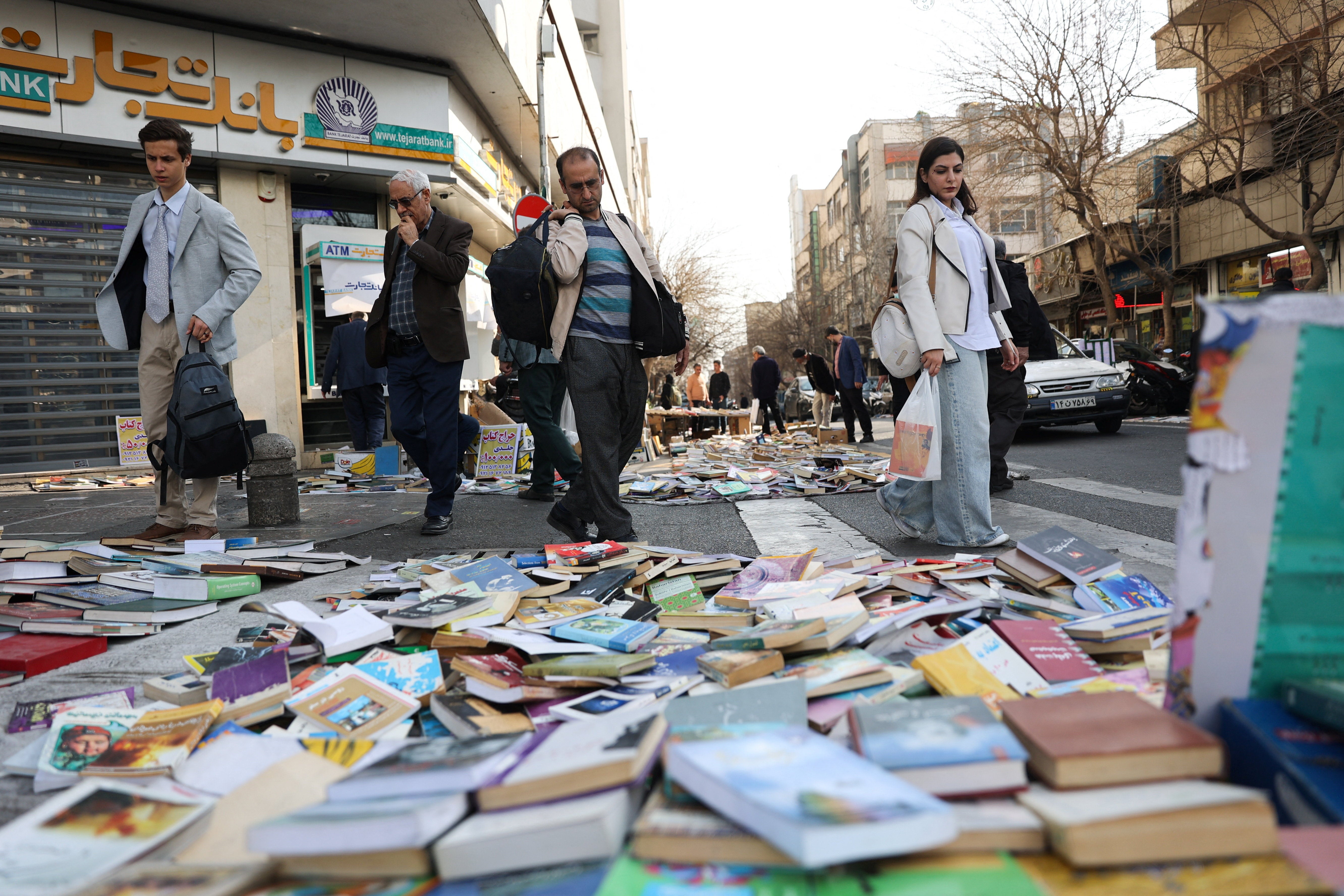 People look at books on a street in Tehran, Iran, February 19, 2026