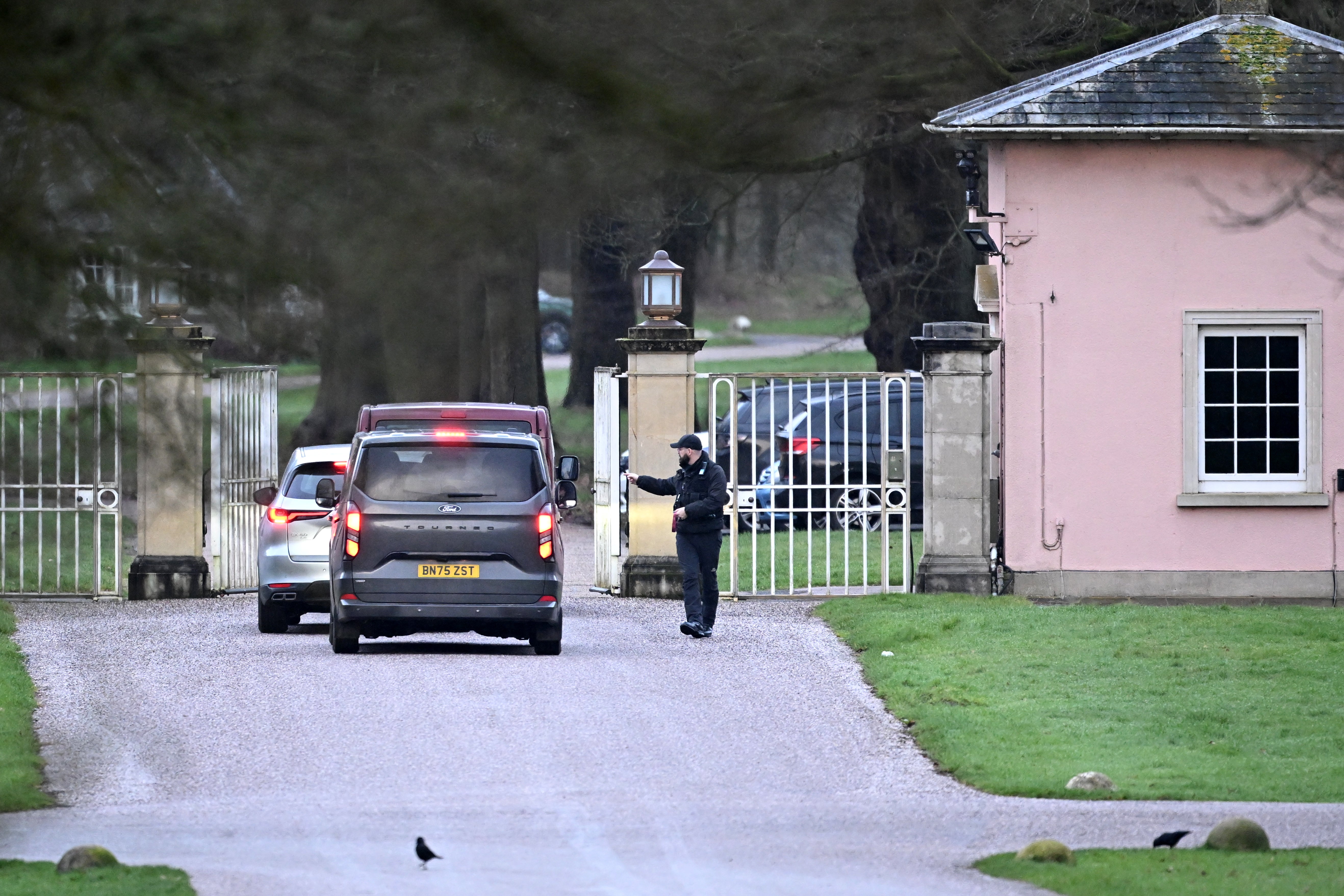 Unmarked police cars arriving at Sandringham on Thursday morning