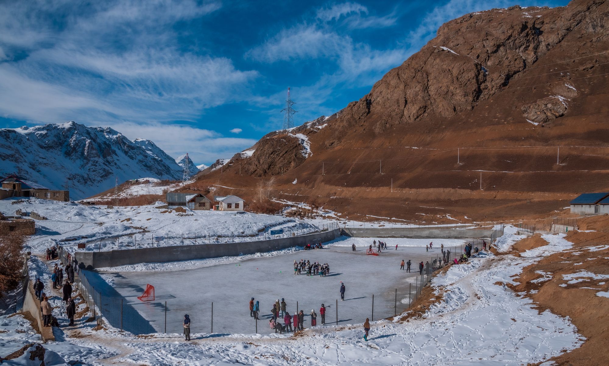 Locals play hockey on makeshift ice rinks in the mountains