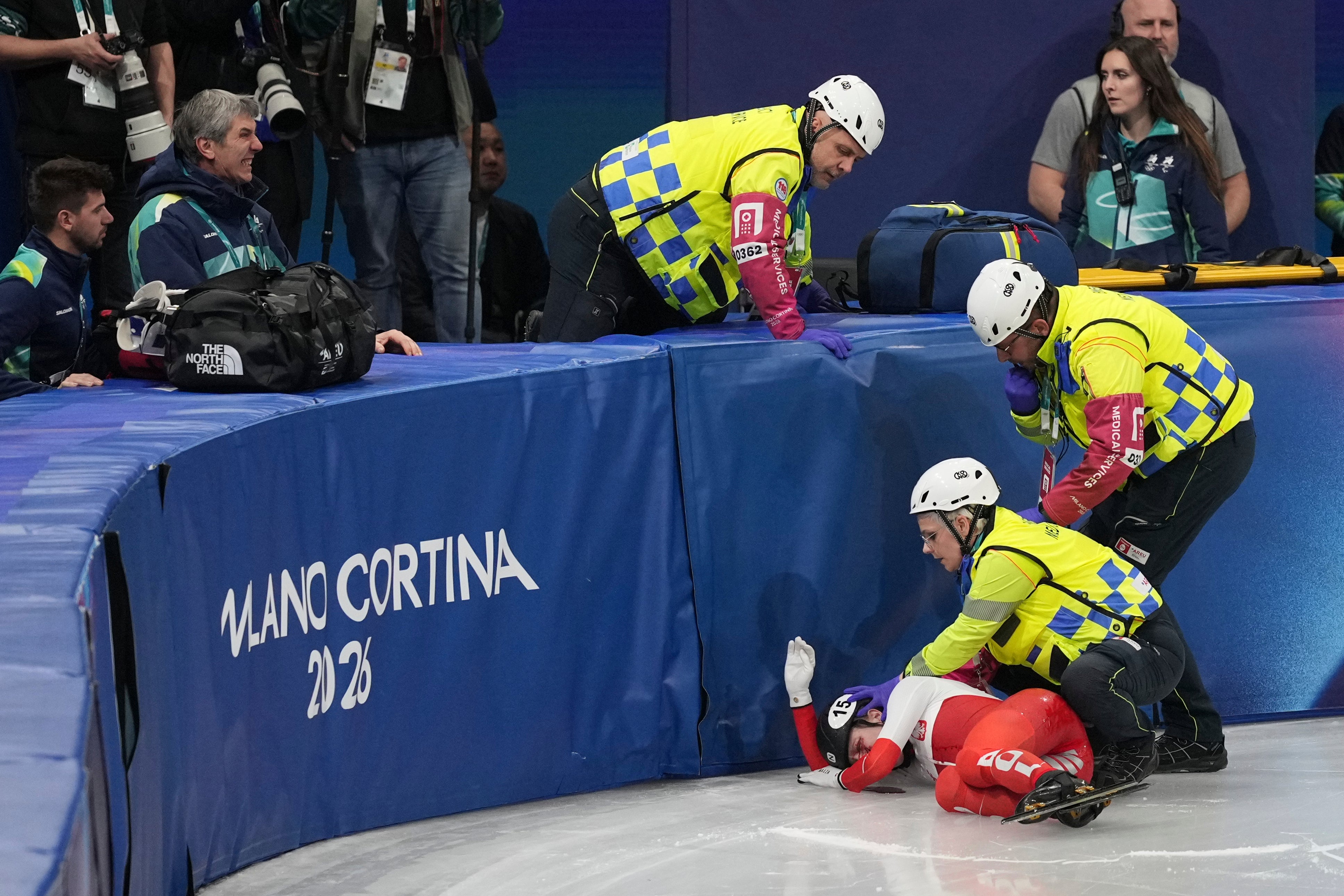 <p>Medics tend to Kamila Sellier after her fall</p>