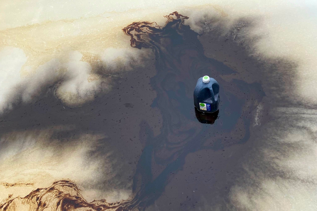 <p>A black substance is seen on the surface of a skating rink installed at the Kennedy Center, which officials say was vandalized on Friday</p>