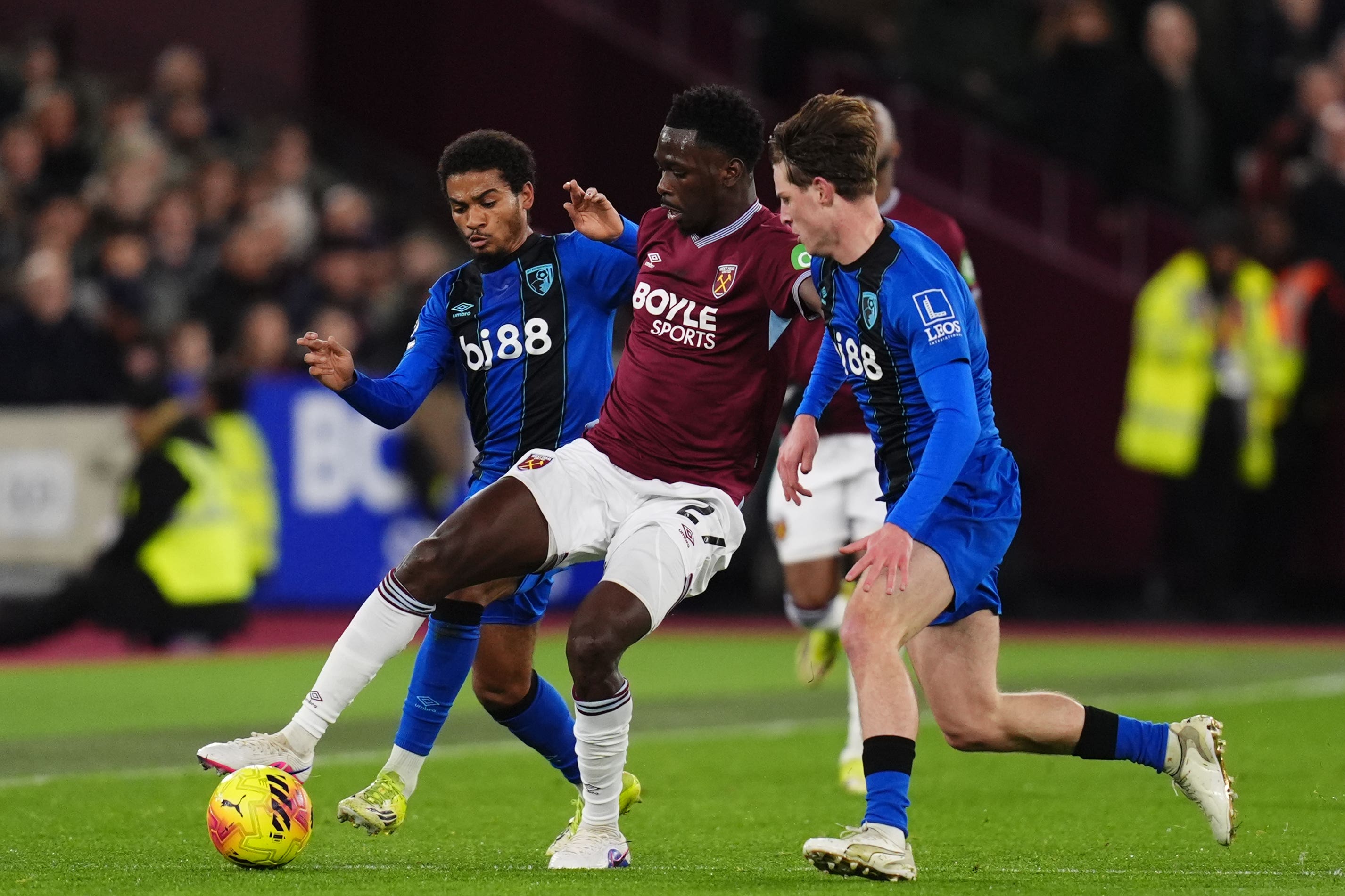 West Ham’s Soungoutou Magassa battles with Amine Adli (left) and Alex Scott (John Walton/PA)
