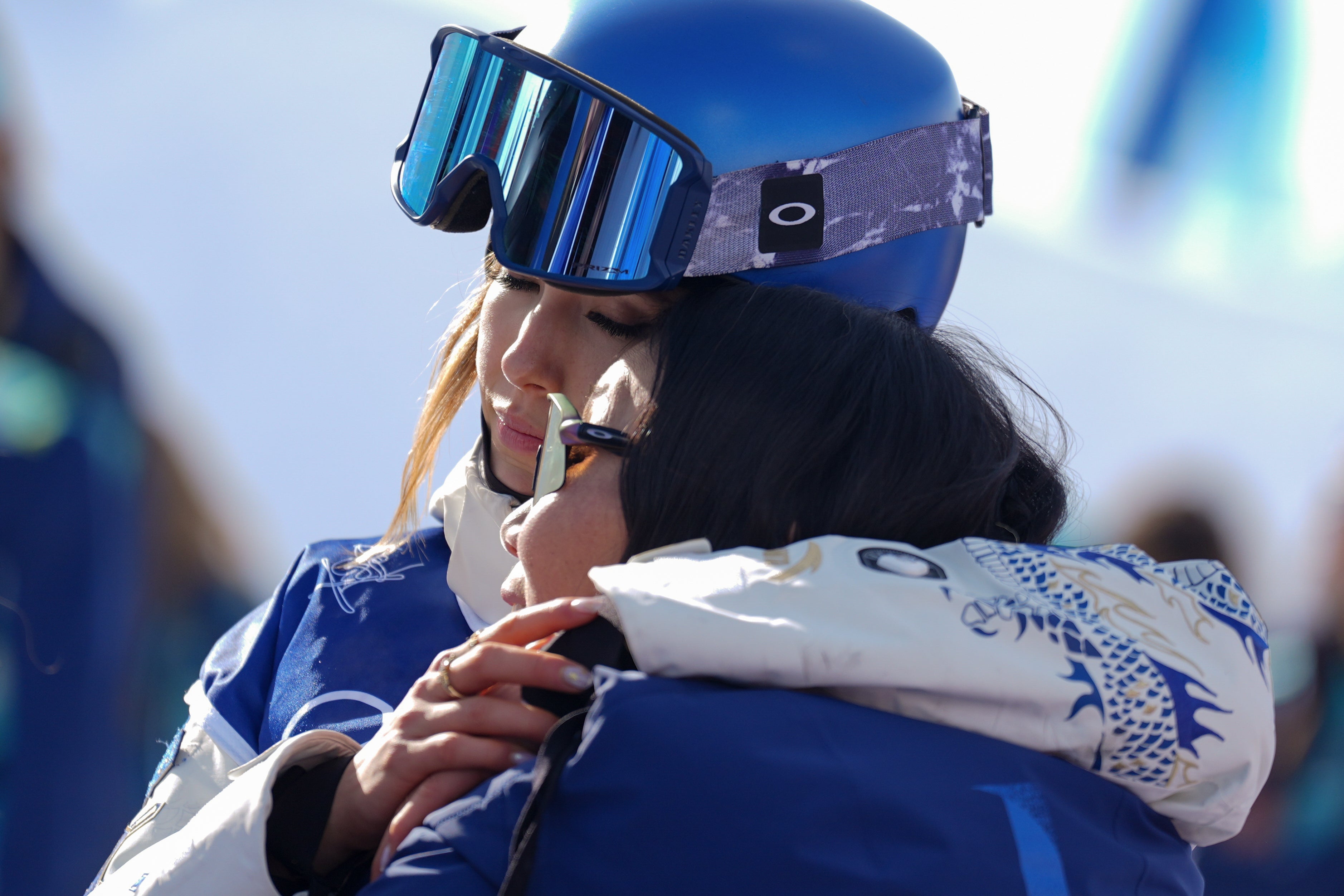 China's Eileen Gu hugs her mother, Yan Gu, during the women's freestyle skiing half-pipe final