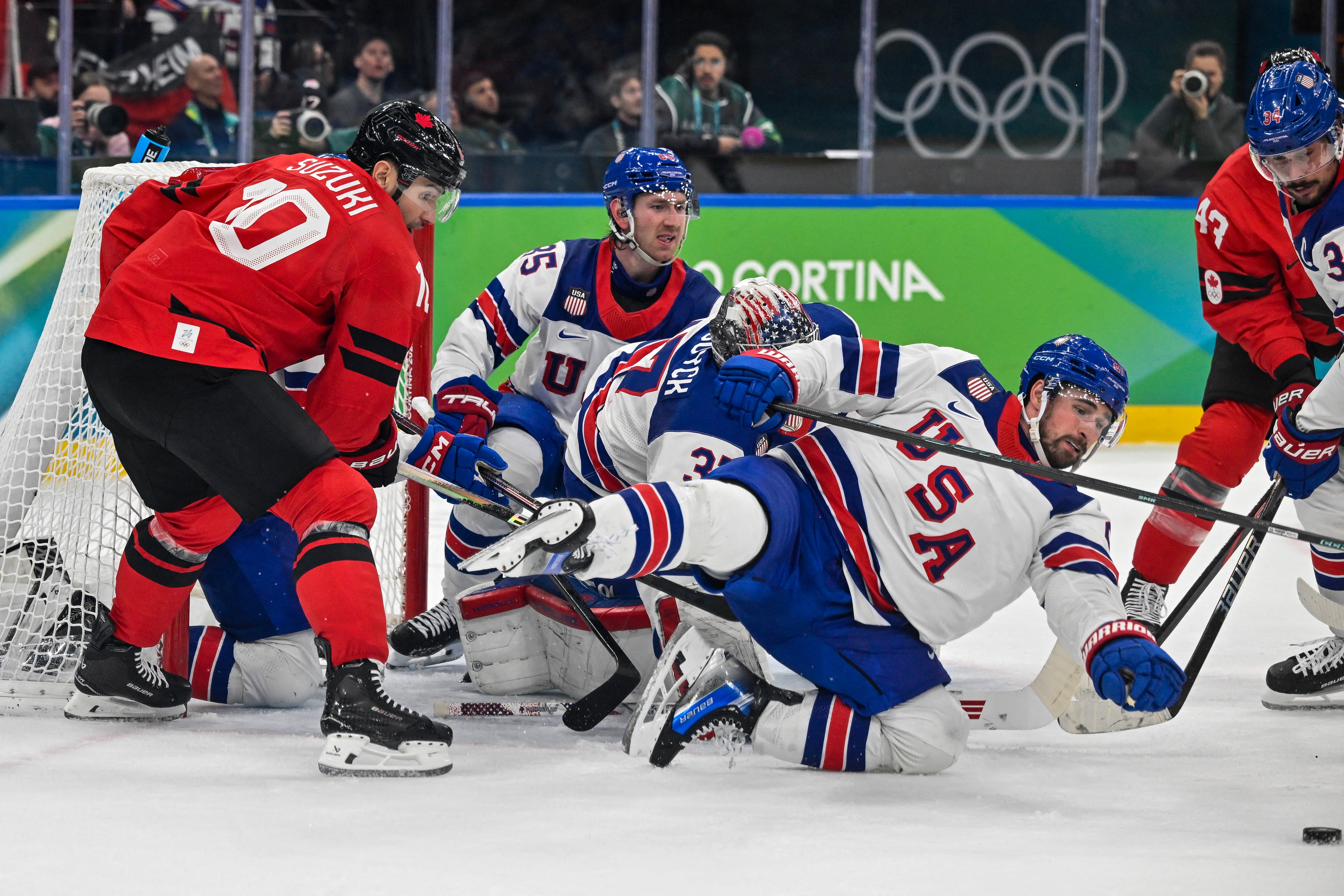 USA beat Canada in sudden-death overtime to win first ice hockey gold since 1980