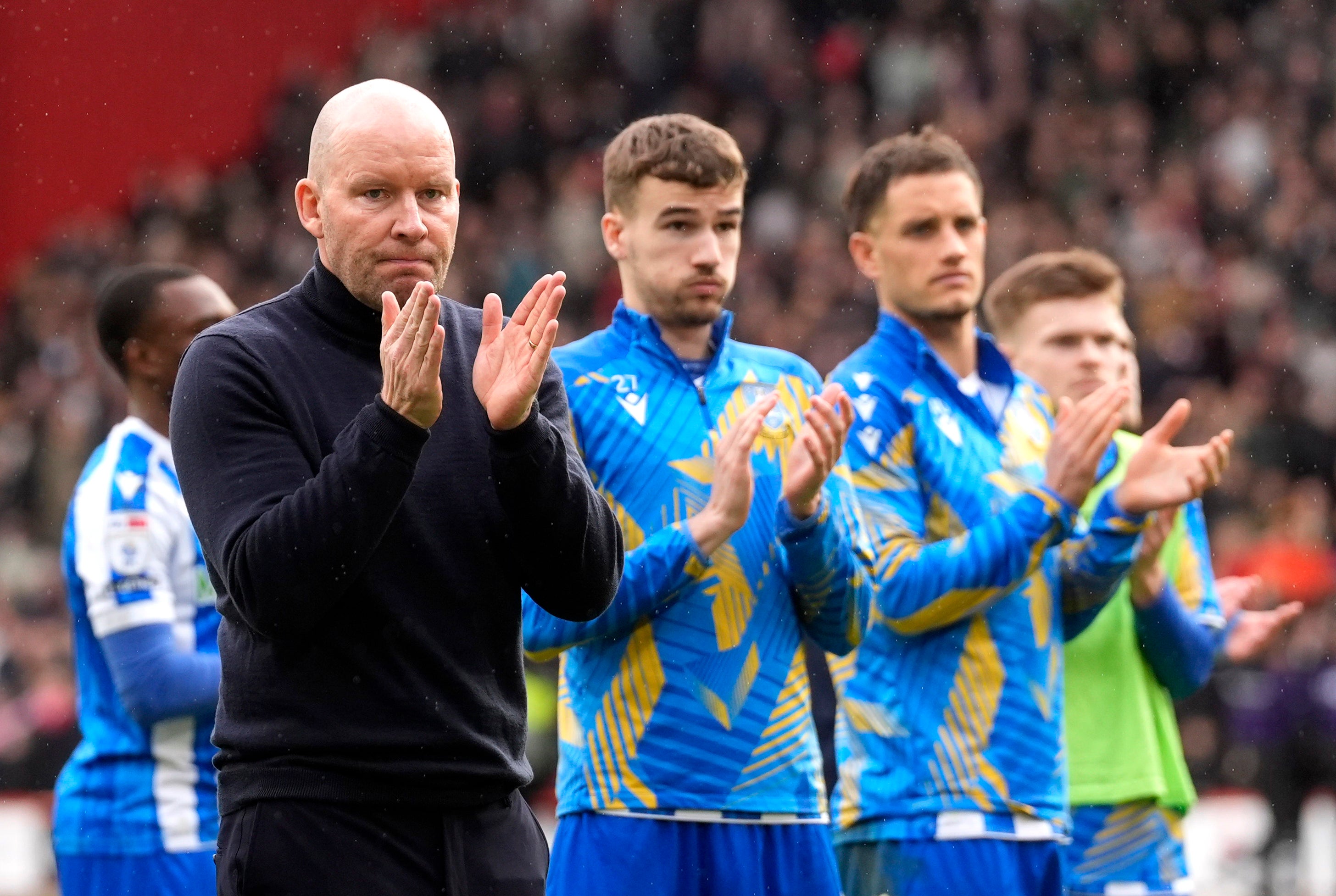 <p>Sheffield Wednesday manager Henrik Pedersen applauds the fans </p>