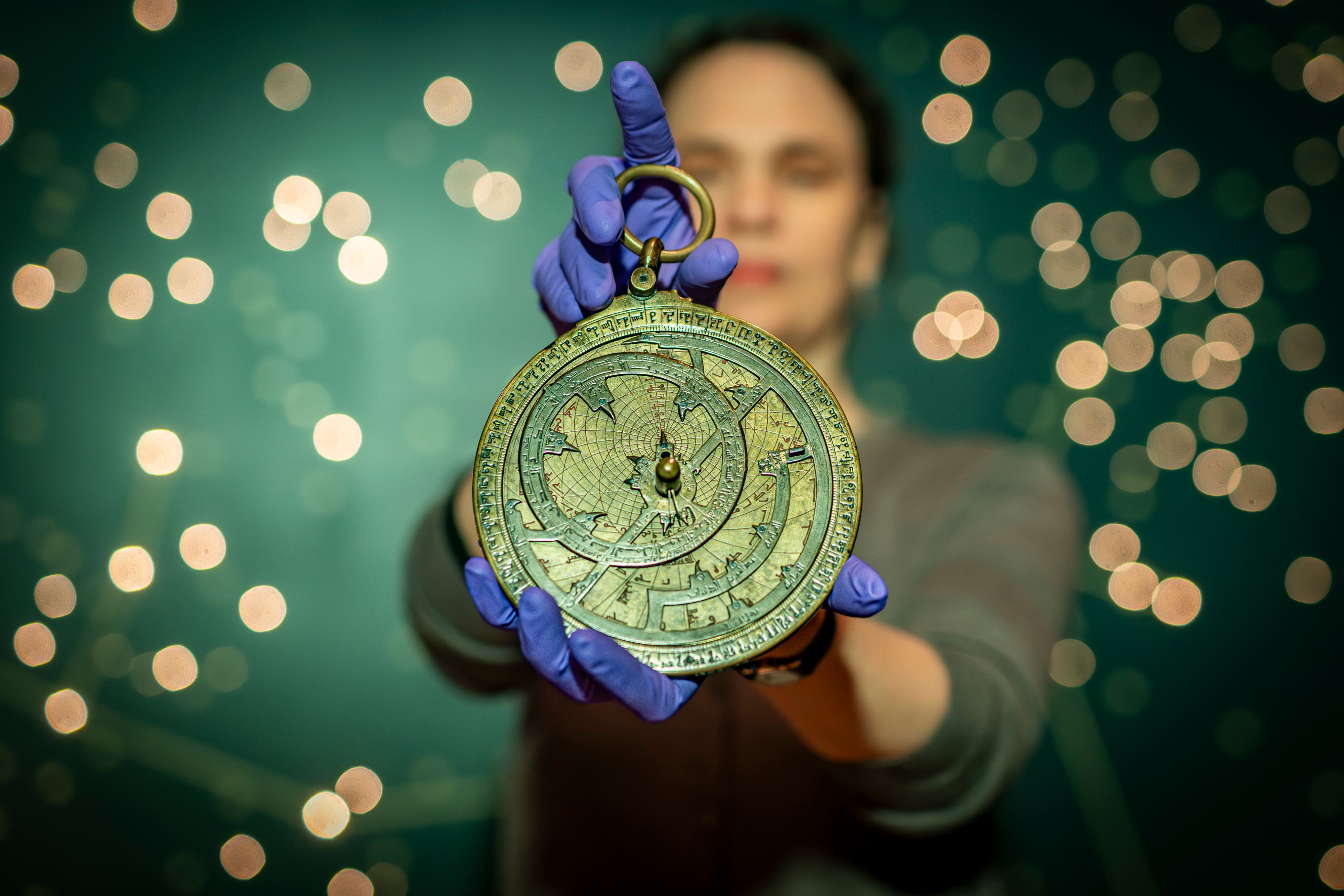 Dr Rebekah Higgitt of National Museums Scotland examines an 11th century astronomical instrument known as an astrolabe on the 1,000th anniversary of its creation (Andy Catlin/PA)