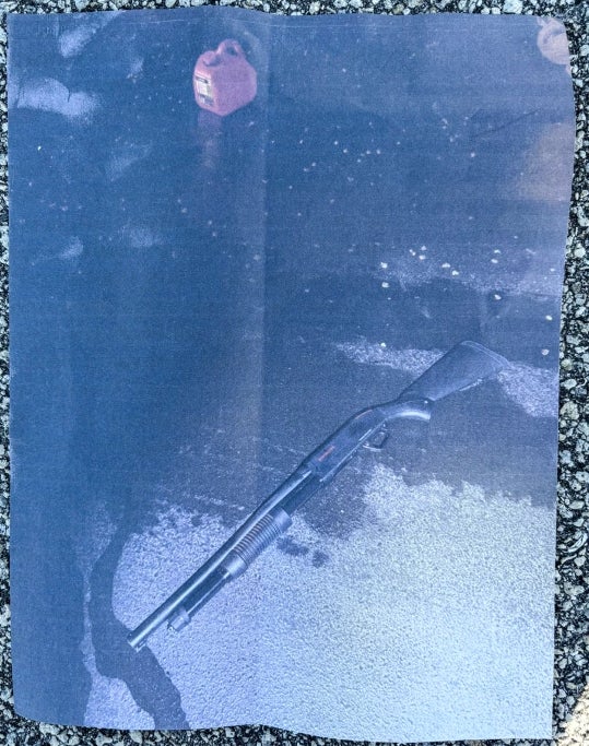 The shotgun and gas canister law enforcement found the suspect carrying when he broke into Mar-a-Lago