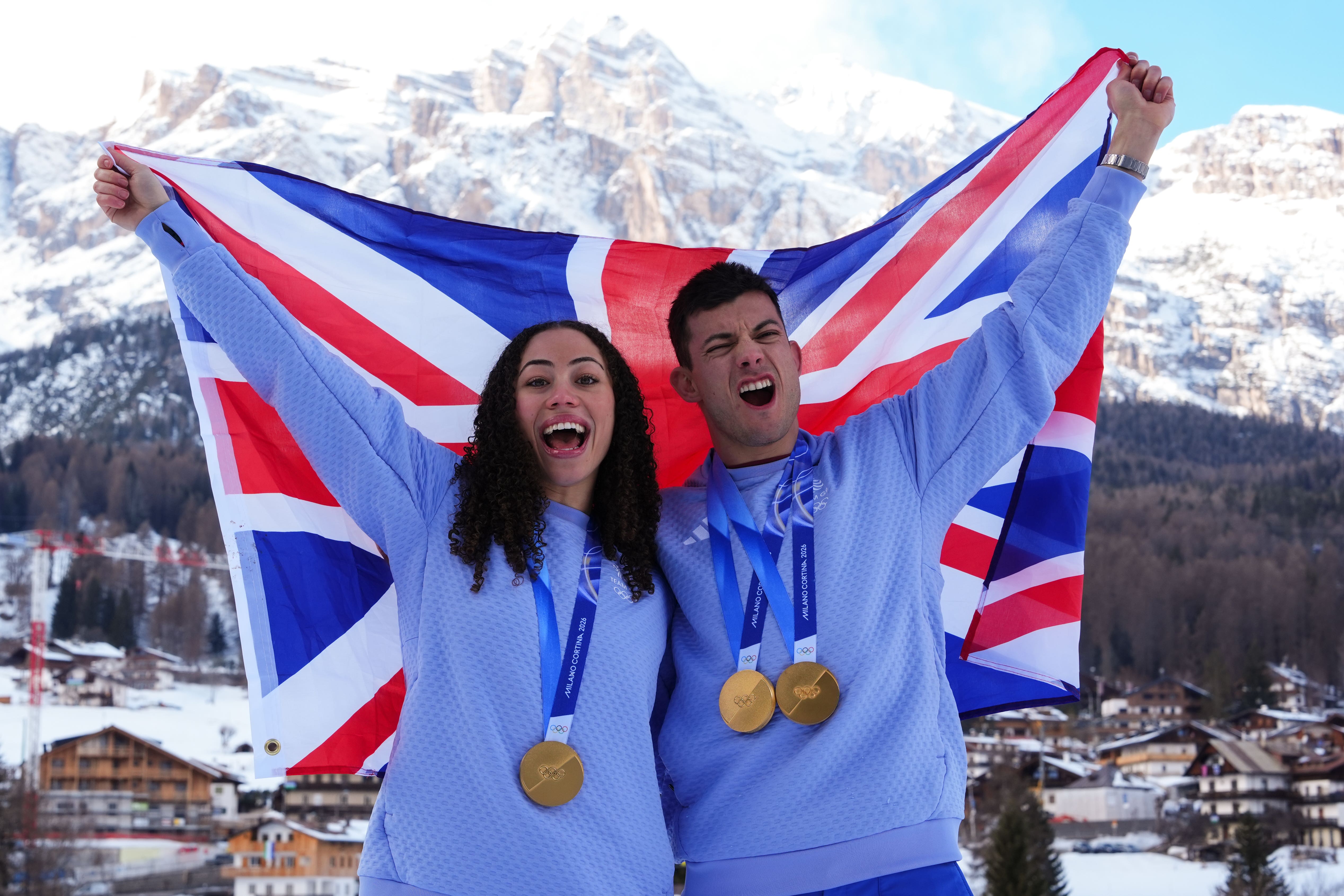 Great Britain’s Matt Weston and Tabby Stoecker with their gold medals as the King sent his congratulations to Winter Olympic medallists (Andrew Milligan/PA)