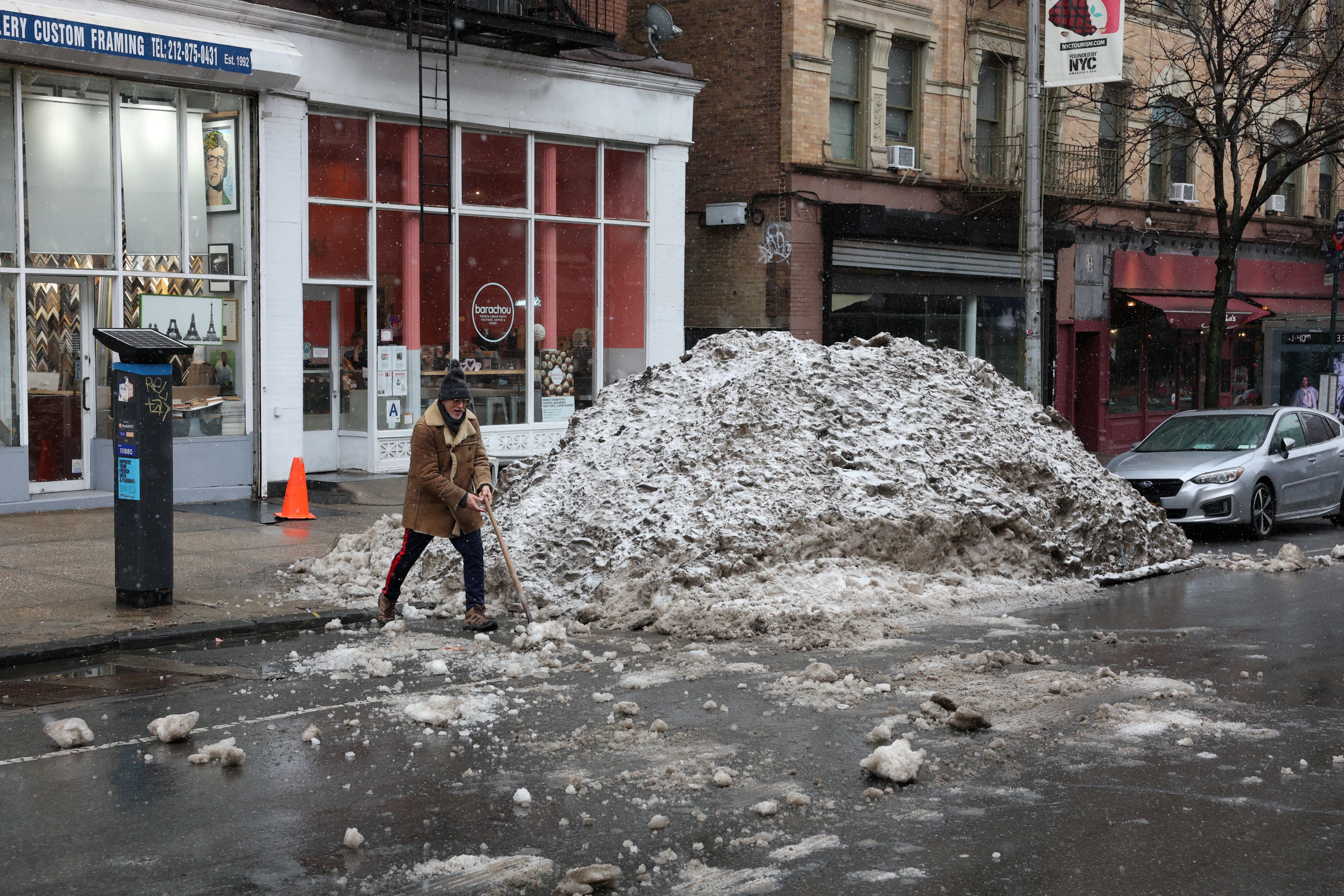 A blizzard warning went into effect as New Yorkers continued to contend with snowfall from a January storm that is believed to have killed an estimated 26 people