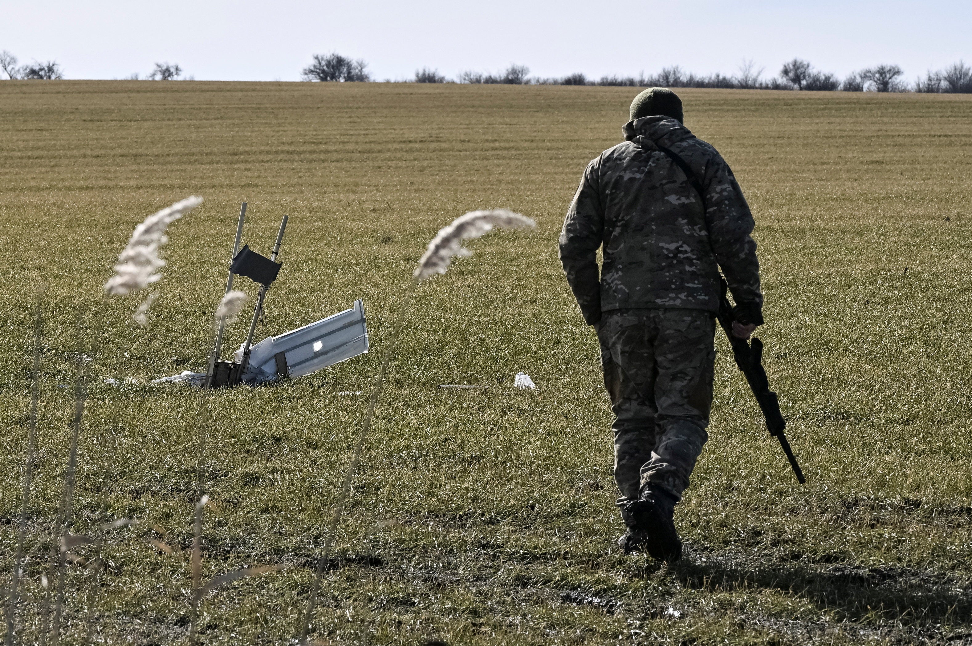 Ukrainian serviceman looks at an unexploded Russian combat drone, amid Russia's attack on Ukraine, in Zaporizhzhia region, Ukraine, on 22 February 2026