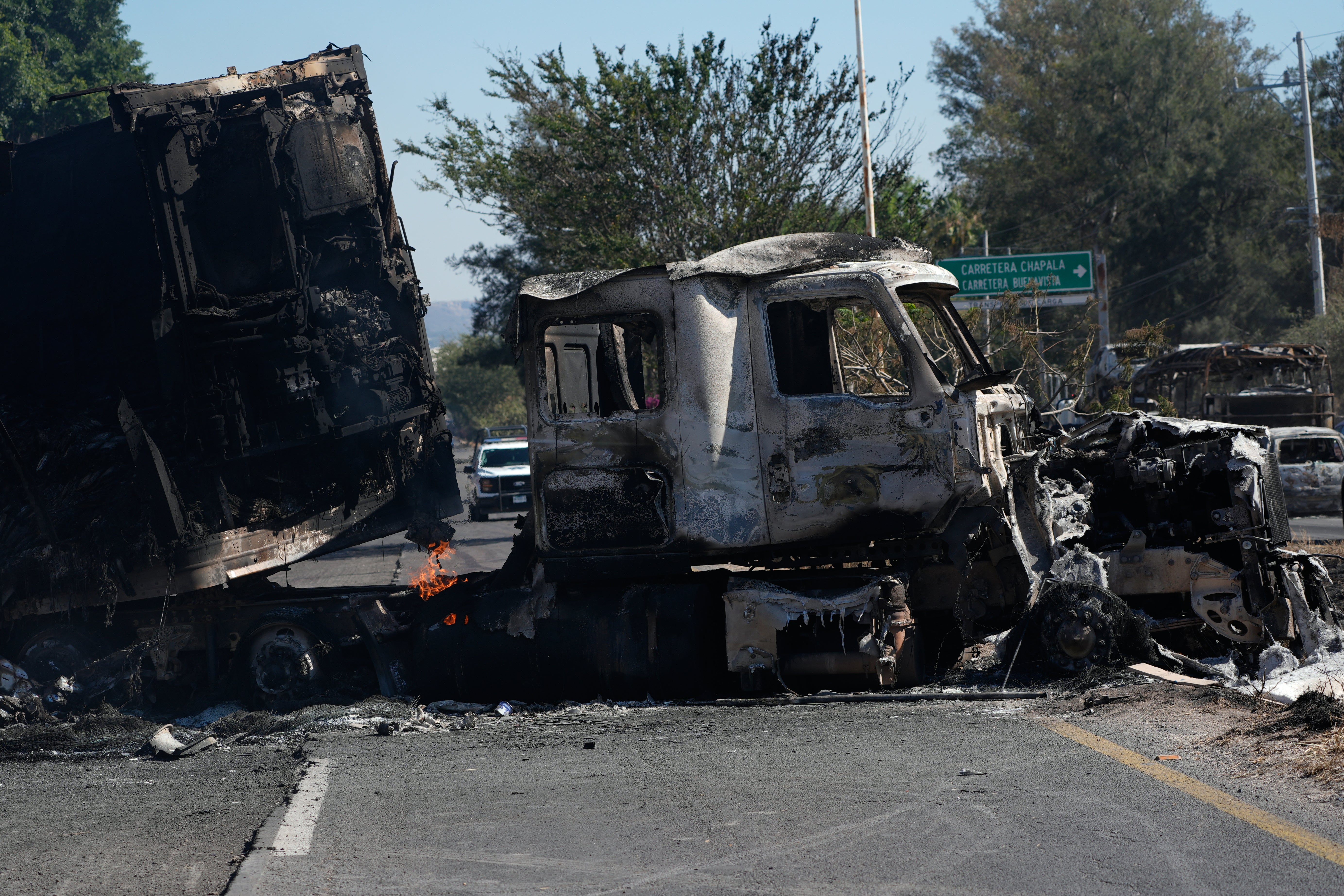 A charred truck blocks a road the day after the Mexican army killed Jalisco New Generation Cartel leader Nemesio Oseguera Cervantes, known as ‘El Mencho’