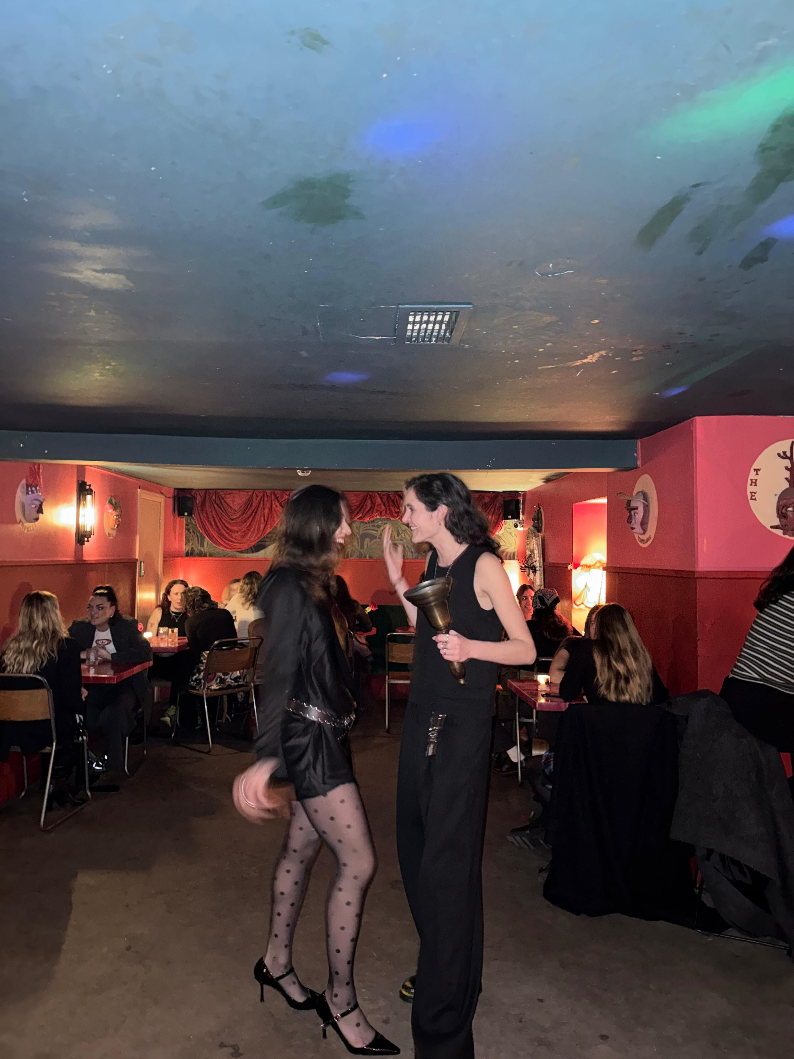 Olivia and a friend at the queer version of her dating event