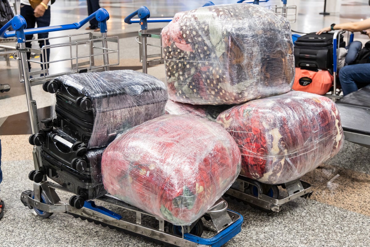Luggage Rapping Why you should never wrap your luggage in plastic, according to a ...