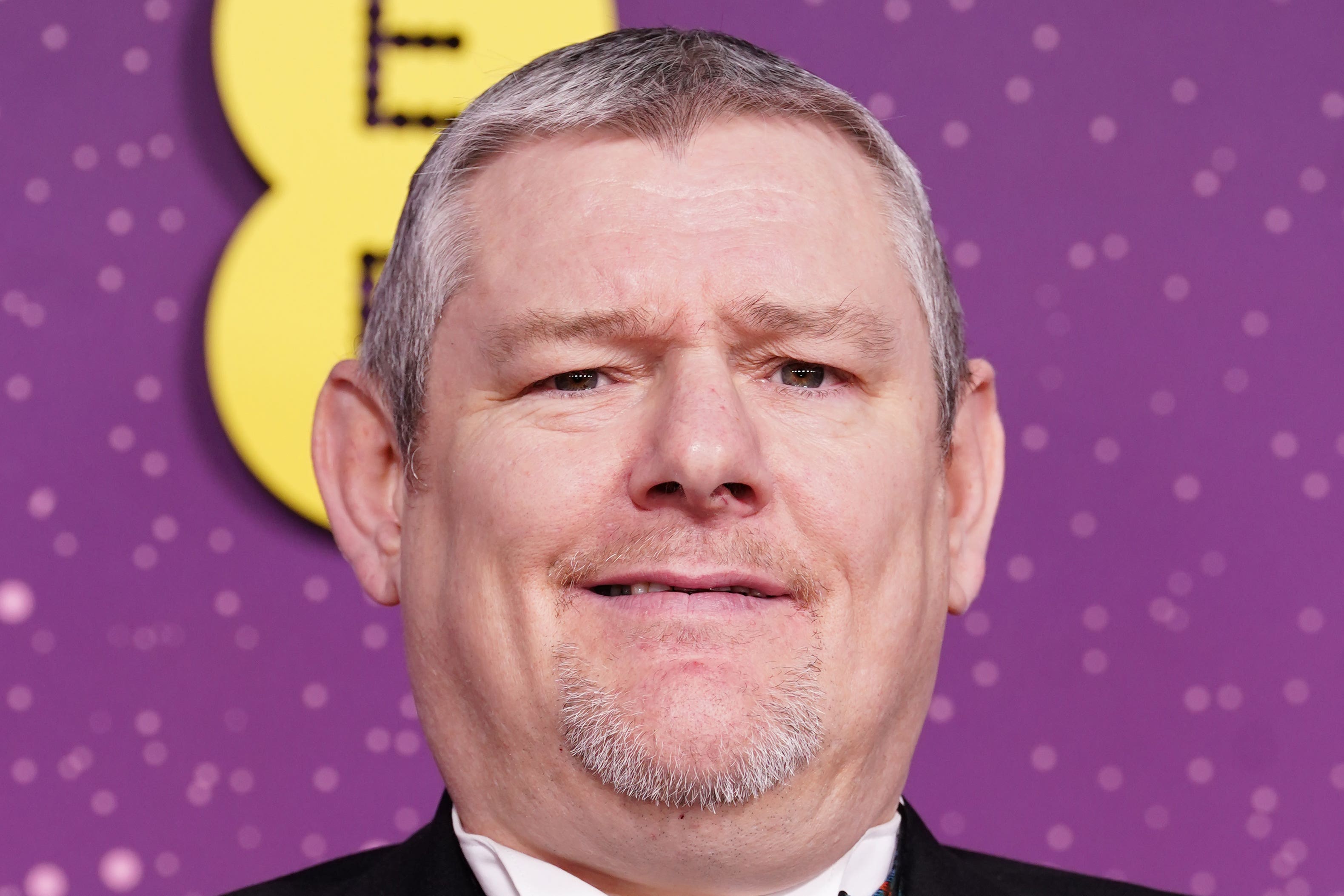 John Davidson, attivista della sindrome di Tourette, ai Bafta del 2026 (Ian West/PA)