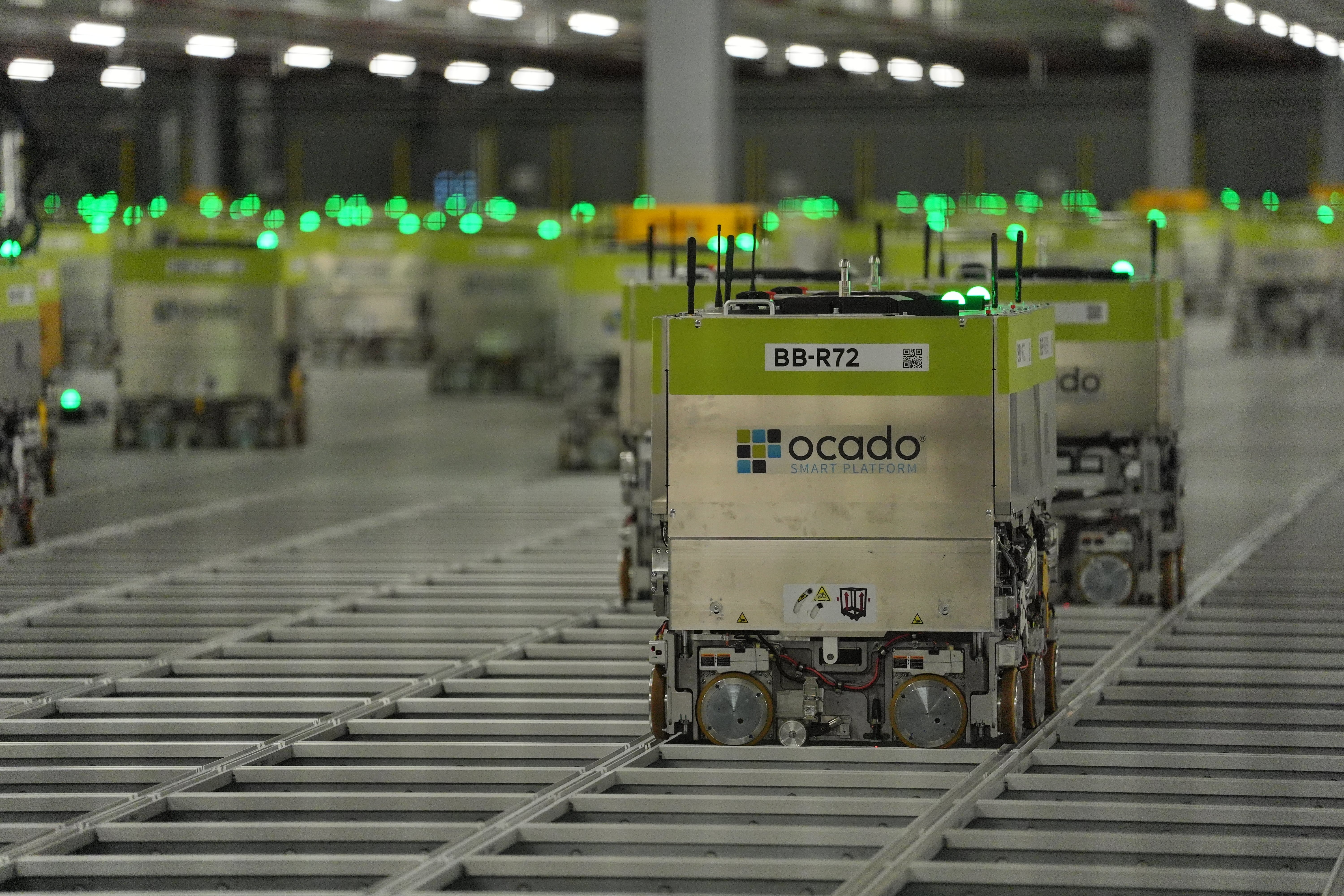 Automated picking machines at the Ocado distribution warehouse (Jonathan Brady/PA)