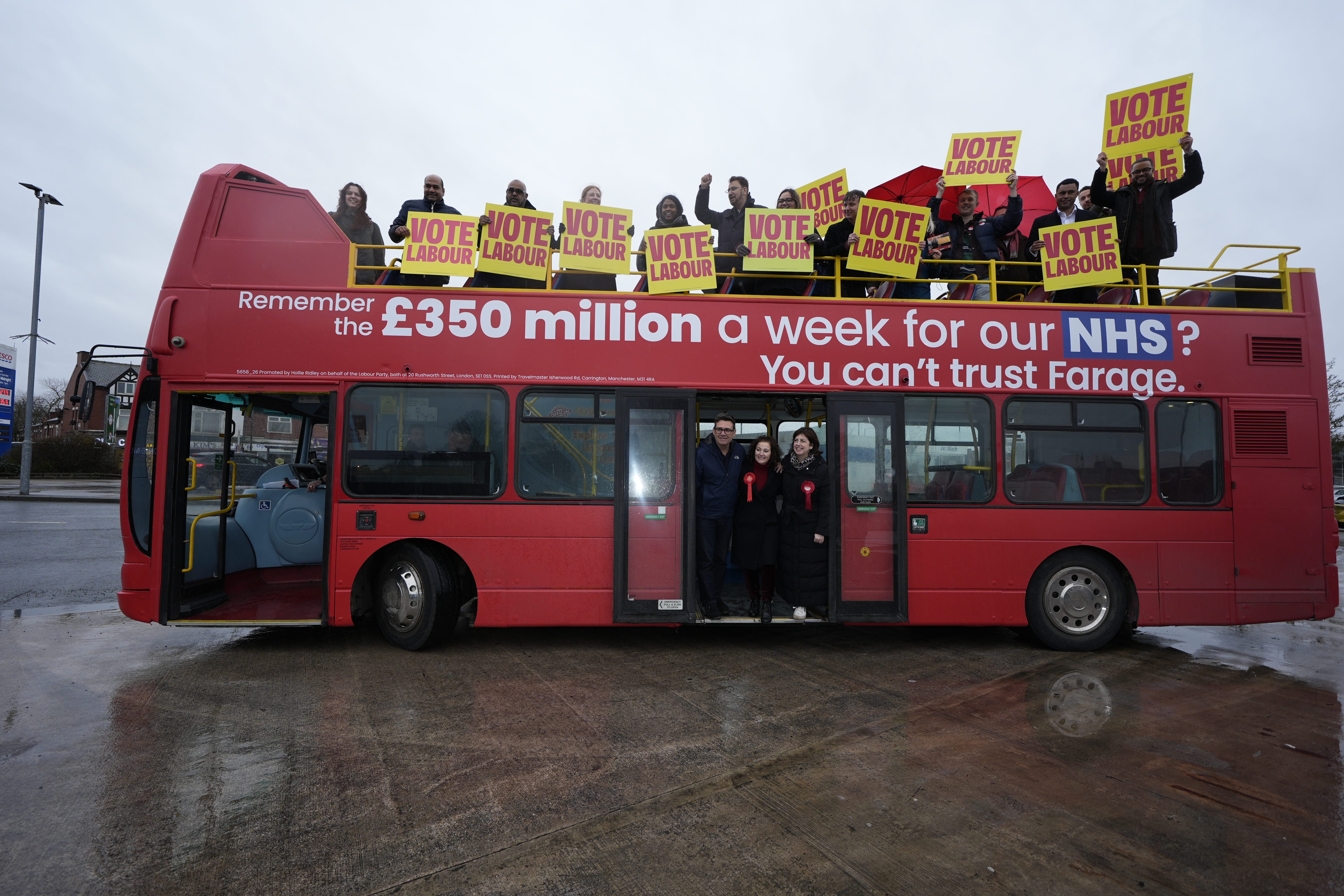 Labour Party candidate Angeliki Stogia (bottom centre) is joined by Andy Burnham (bottom left) and Lucy Powell during a polling day campaign event