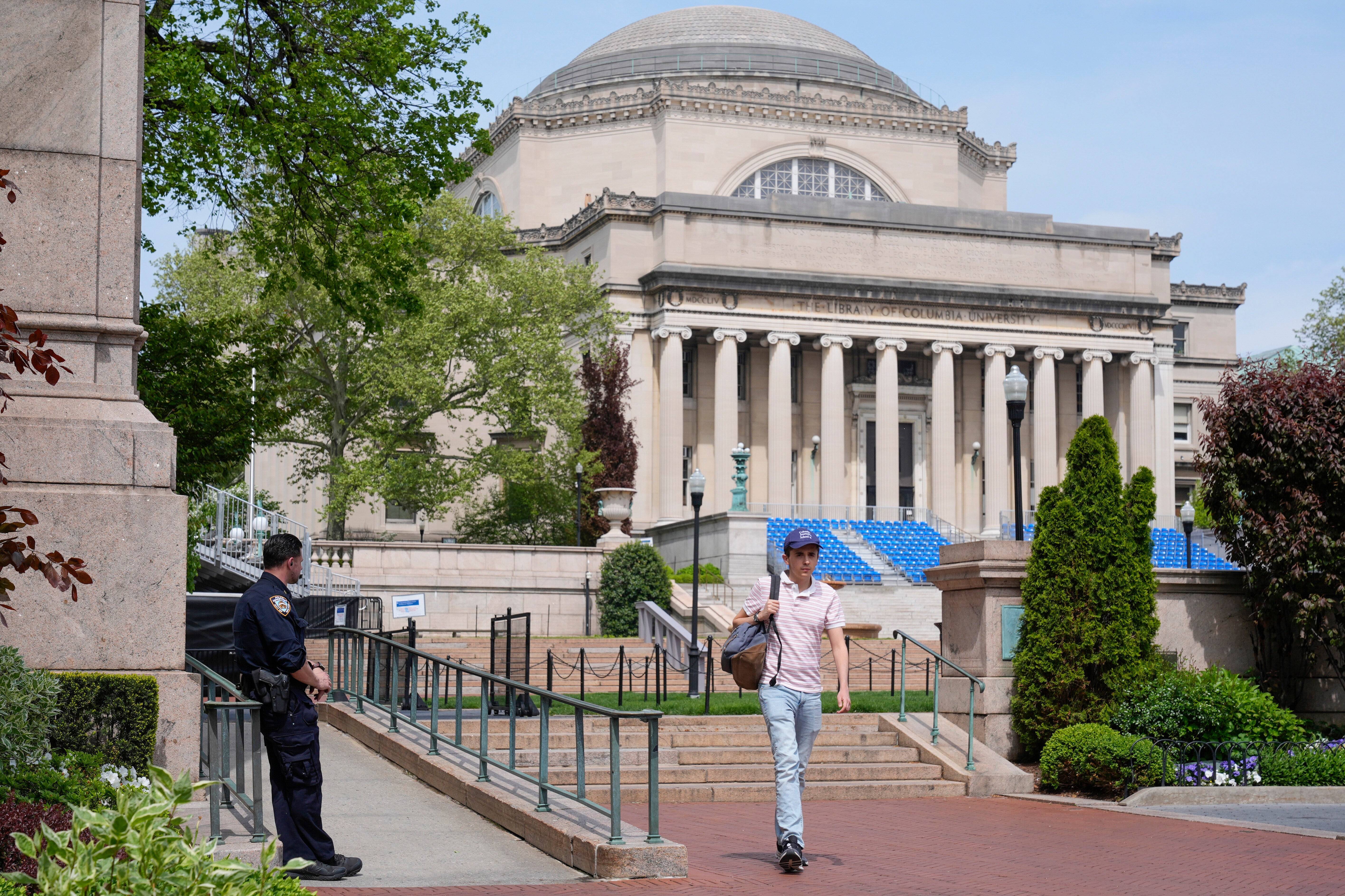 A New York City police officer keeps watch on the campus of Columbia University in New York, May 6, 2024. (AP Photo/Seth Wenig, File)